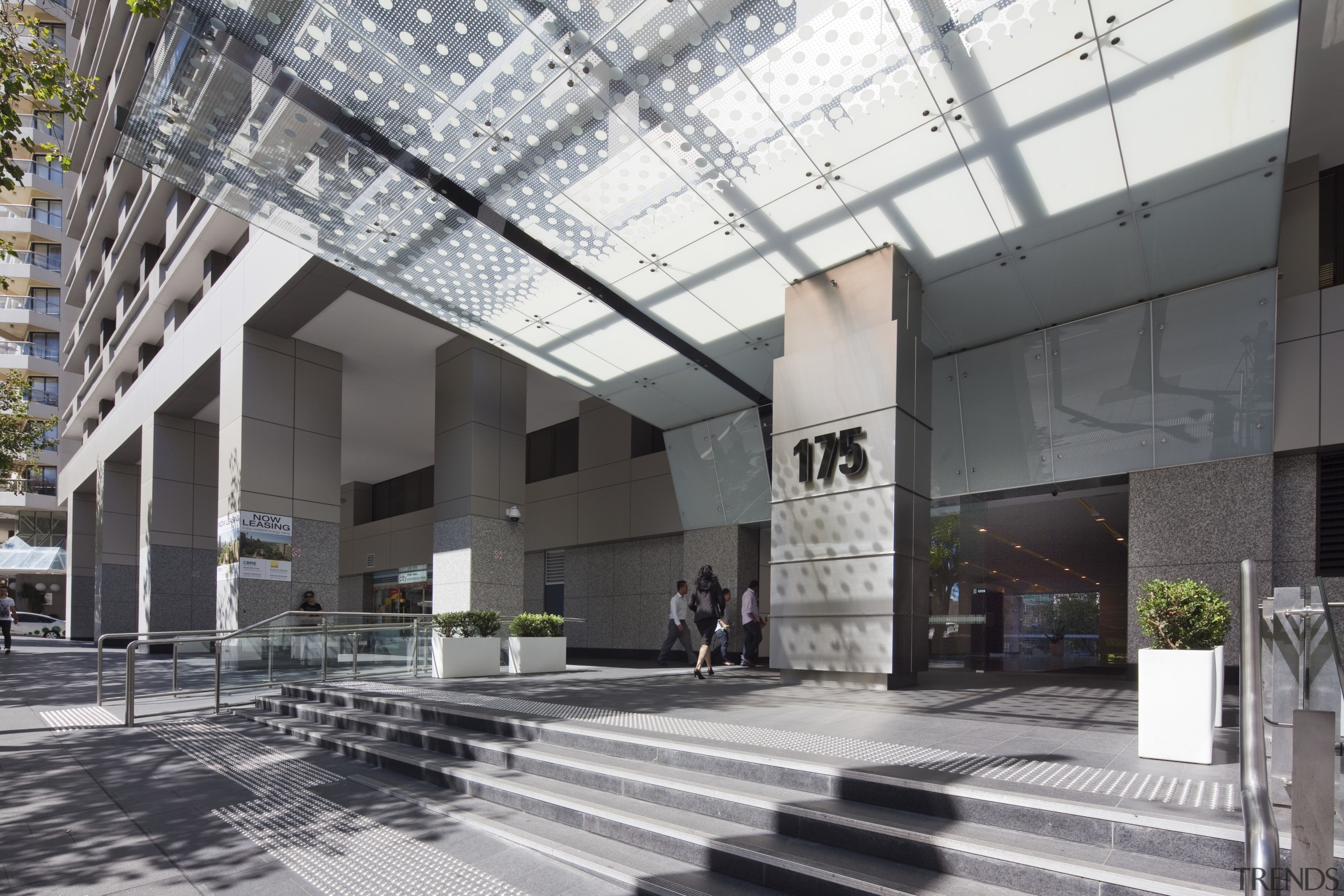 View of high rise office tower with wooden building, condominium, lobby, metropolitan area, mixed use, gray, black