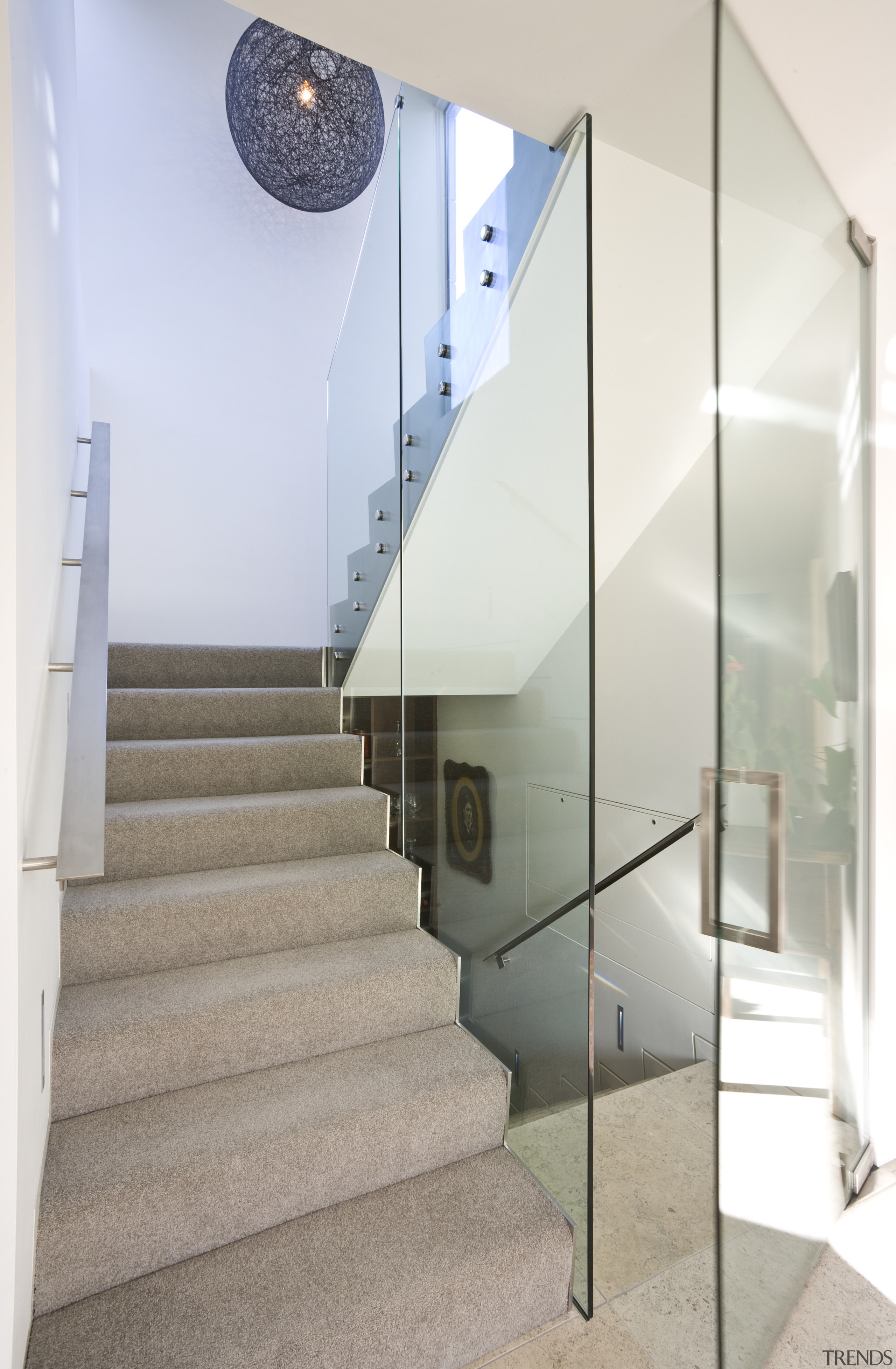 view of stairway with carpeted steps, glass wall architecture, ceiling, daylighting, glass, handrail, home, house, interior design, product design, stairs, white