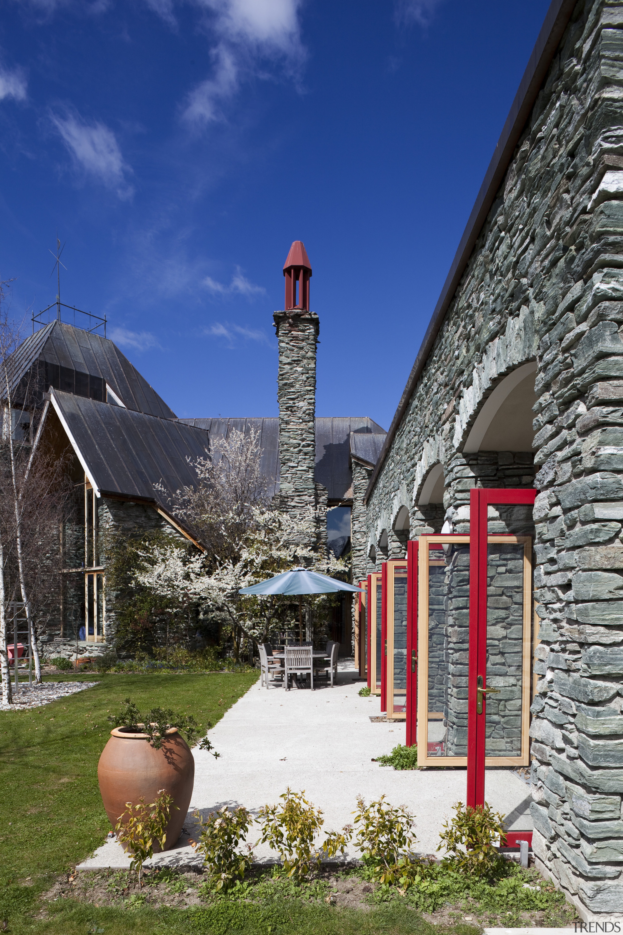 This home in Queenstown was renovated by architect building, house, sky, town, tree, blue