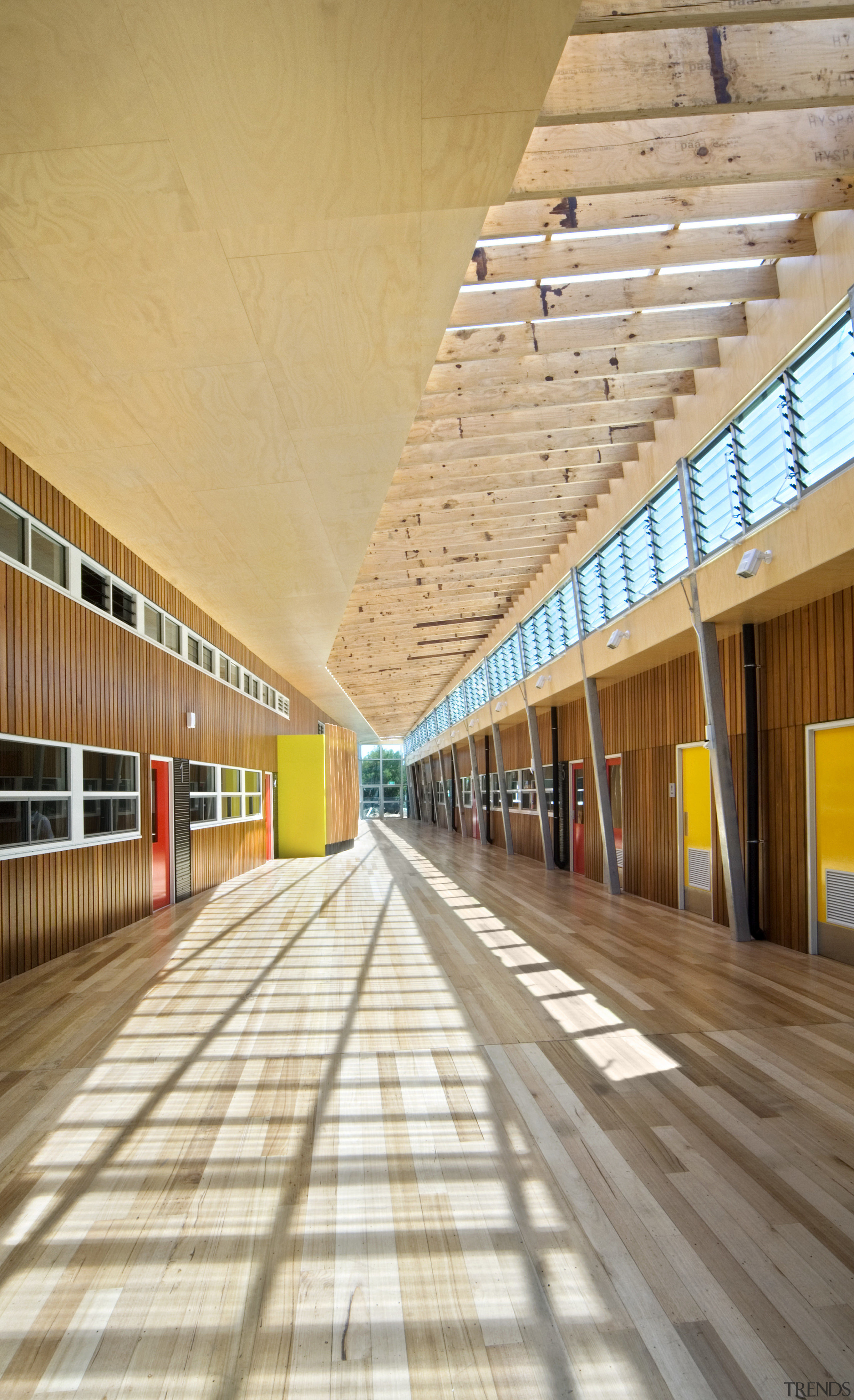 View of Williamstown High School in Melbourne. Designed architecture, daylighting, facade, floor, leisure centre, structure, wood, orange, gray