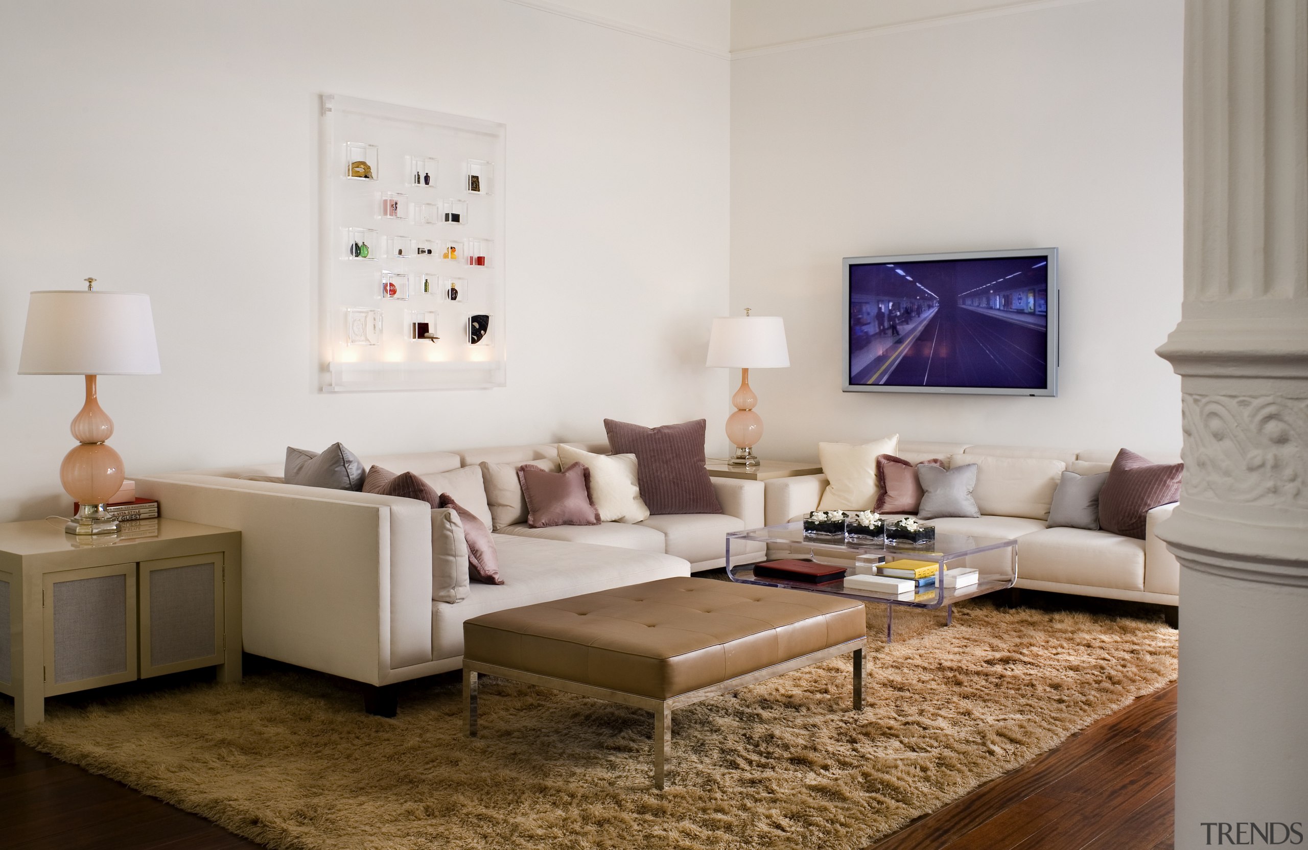 View of living space featuring leather ottoman, mahogany bed frame, coffee table, couch, floor, furniture, home, interior design, living room, room, suite, table, wall, white