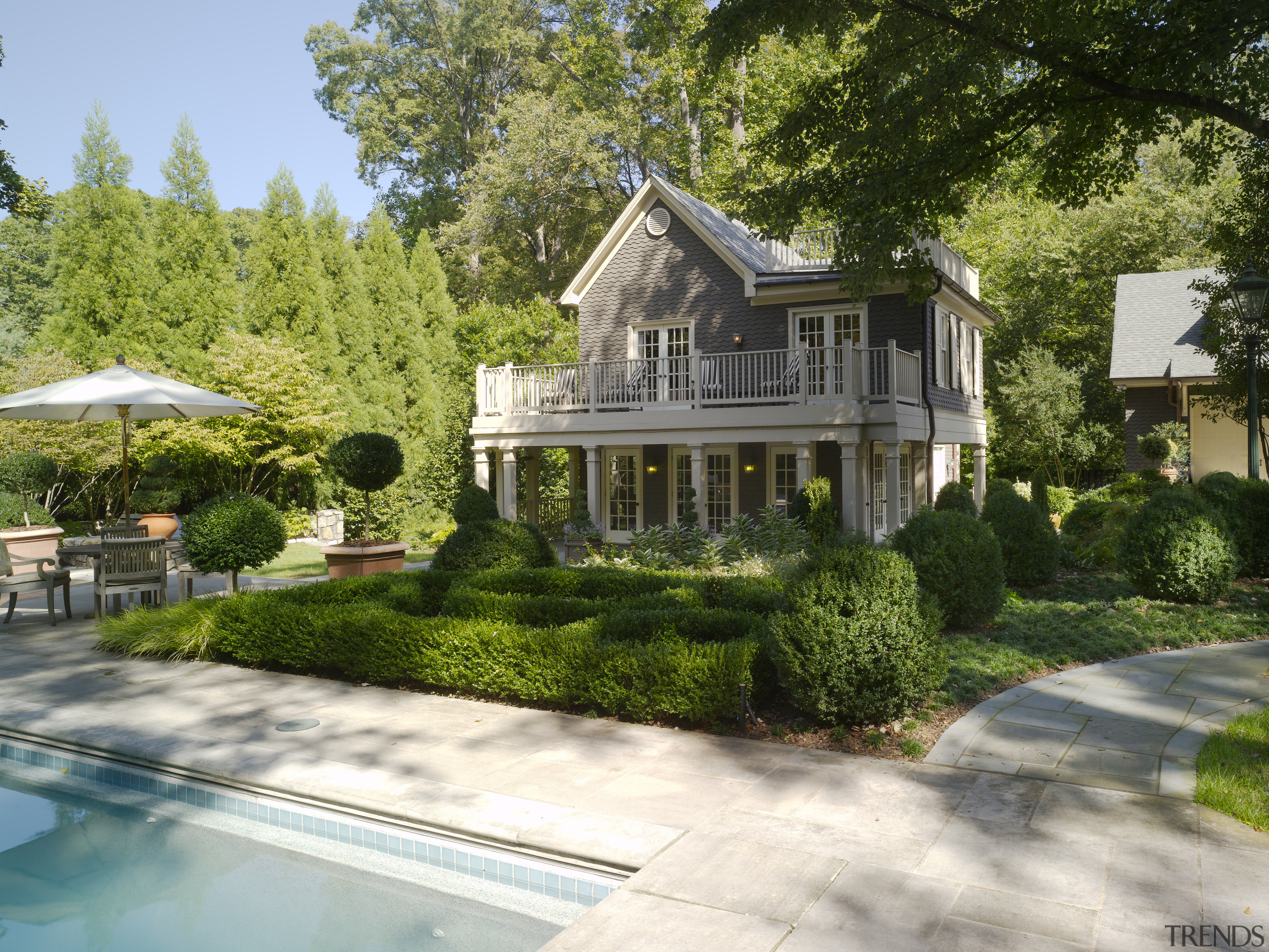 Overview of main outdoor living area features pool, backyard, cottage, estate, home, house, landscape, landscaping, mansion, neighbourhood, plant, property, real estate, residential area, suburb, tree, villa, yard, brown