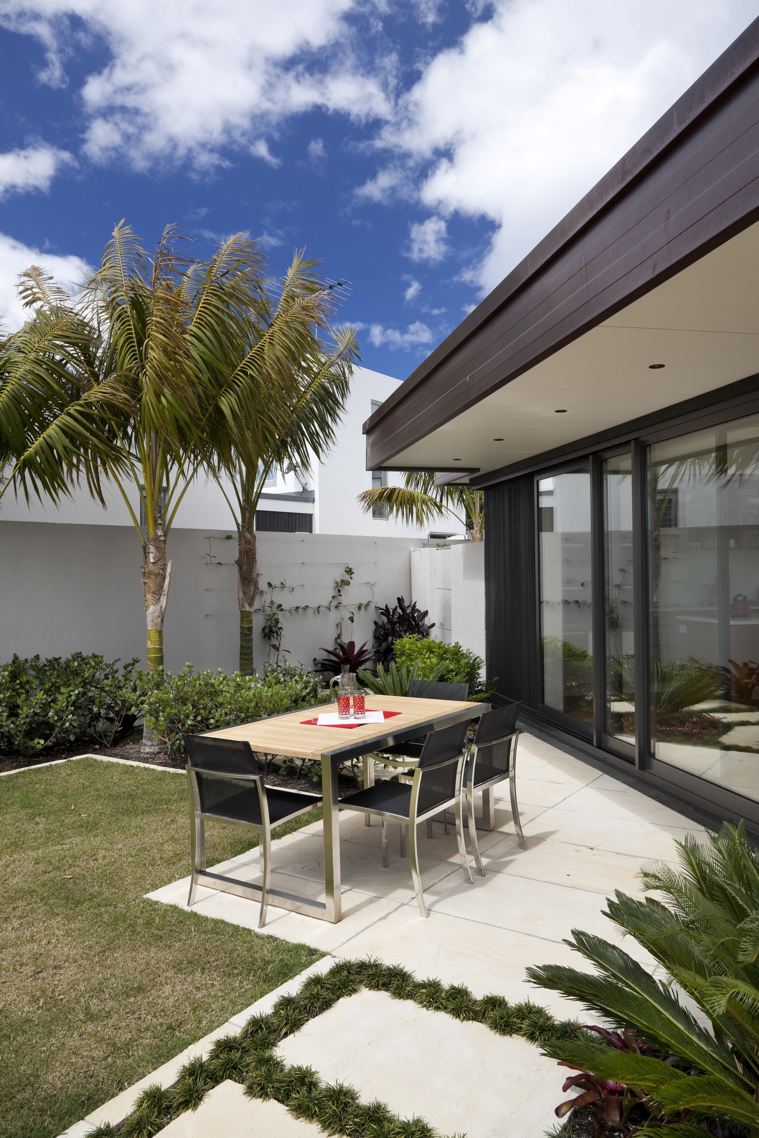 View of pool and patio area of contemporary architecture, arecales, backyard, courtyard, estate, home, house, outdoor furniture, outdoor structure, palm tree, patio, property, real estate, white, brown