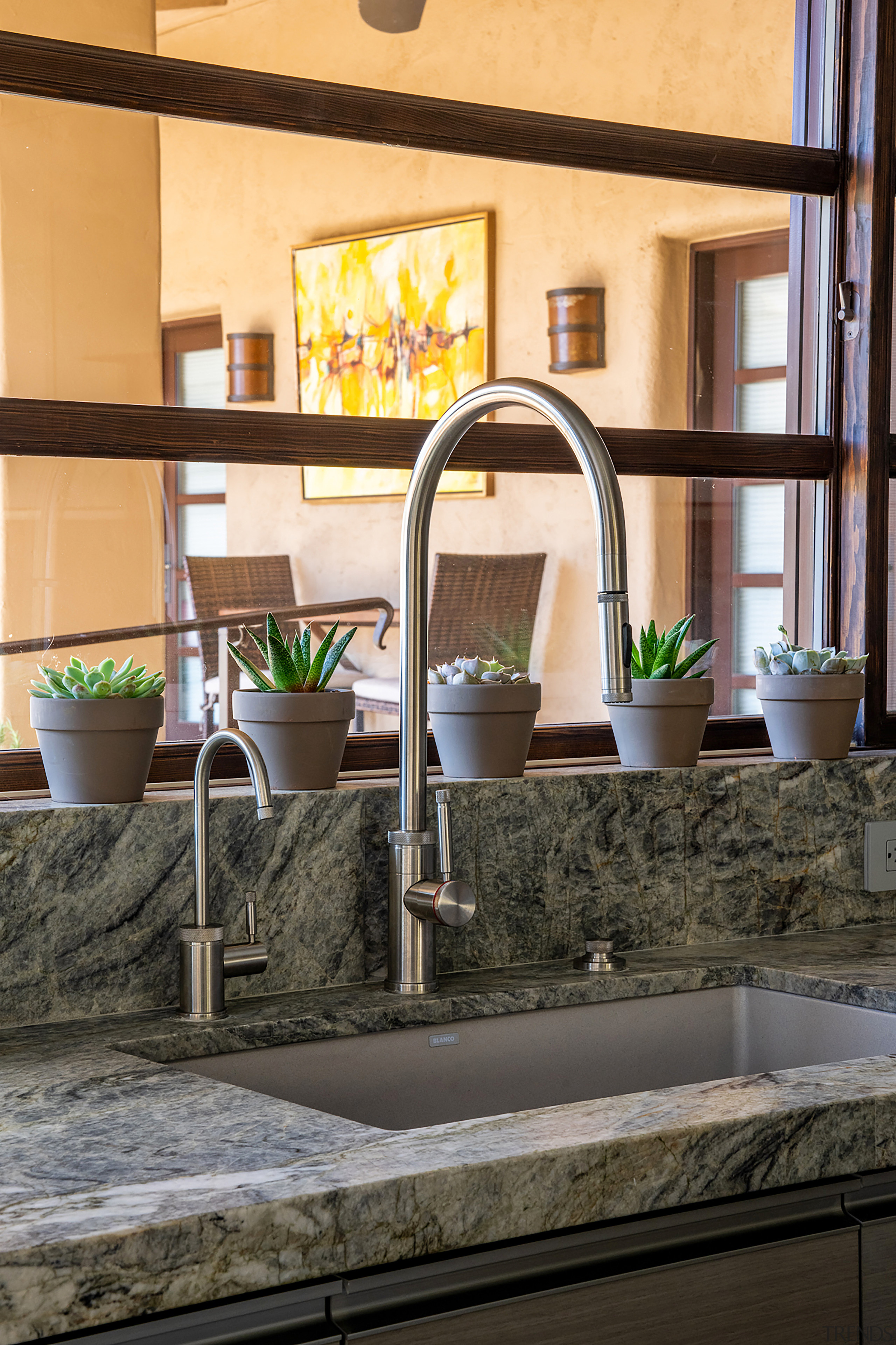 Serving as the countertop &amp; backsplash, the leathered 