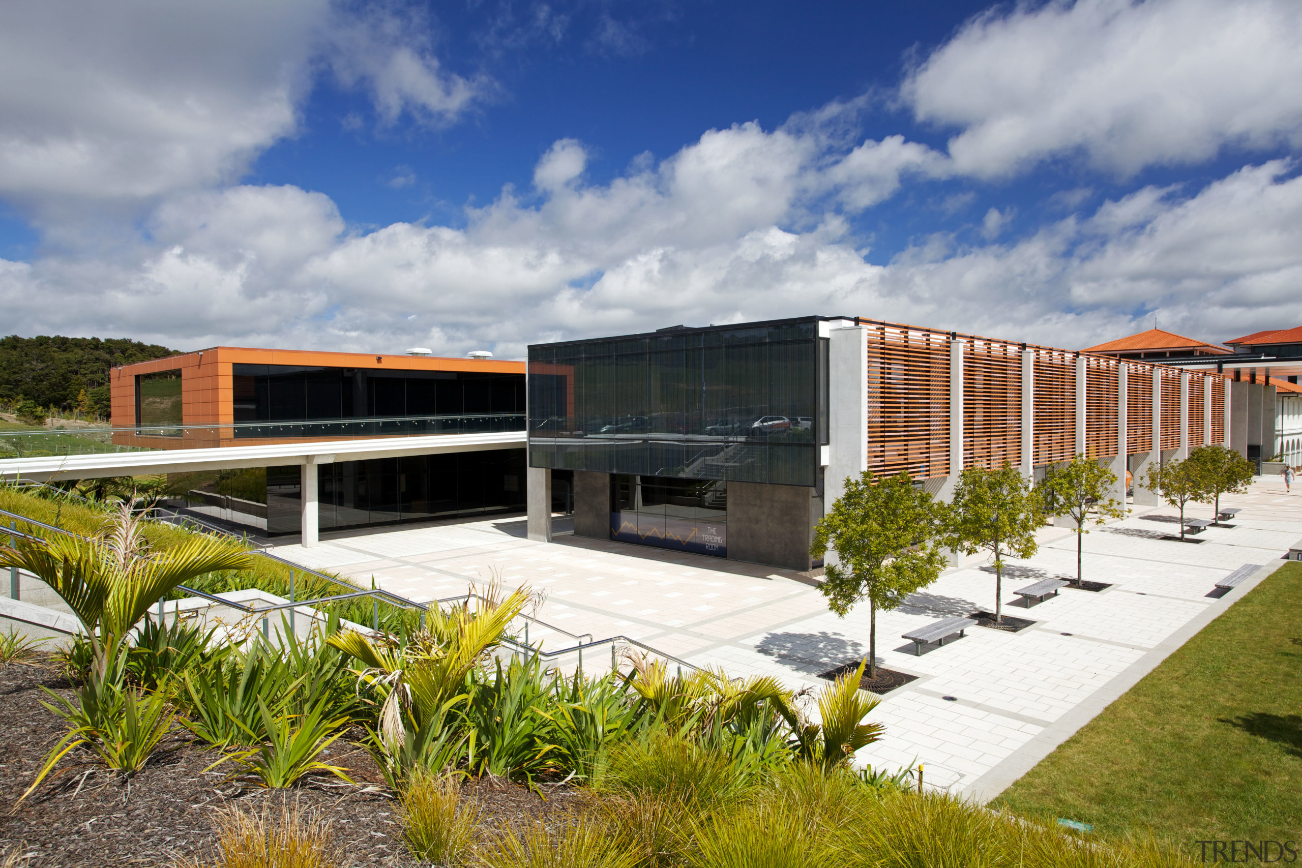 The clean-lined architecure of the facility is matched architecture, corporate headquarters, facade, house, real estate, residential area, sky, gray