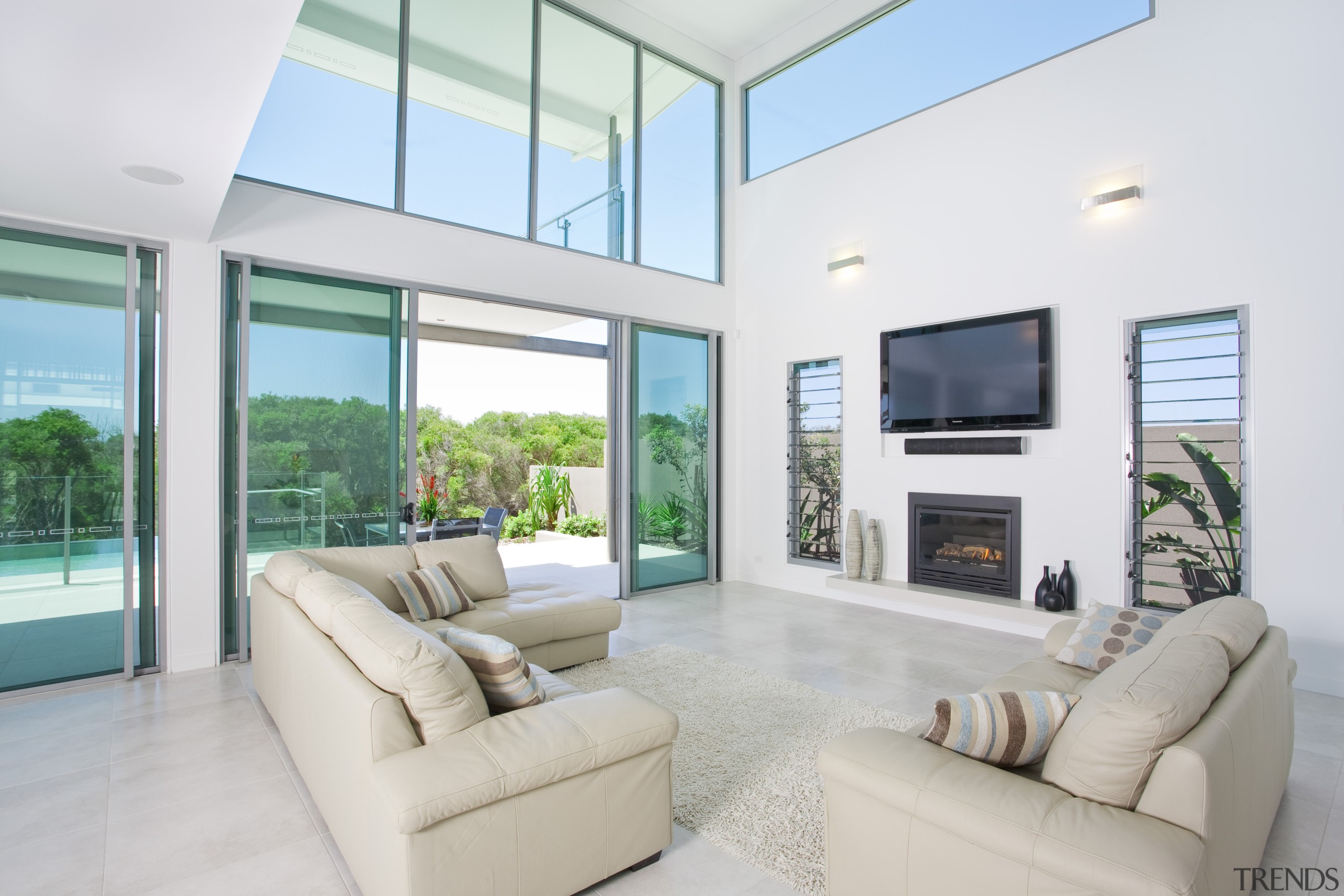 view of the open-plan double-height living area in daylighting, estate, home, house, interior design, living room, penthouse apartment, property, real estate, window, white, gray