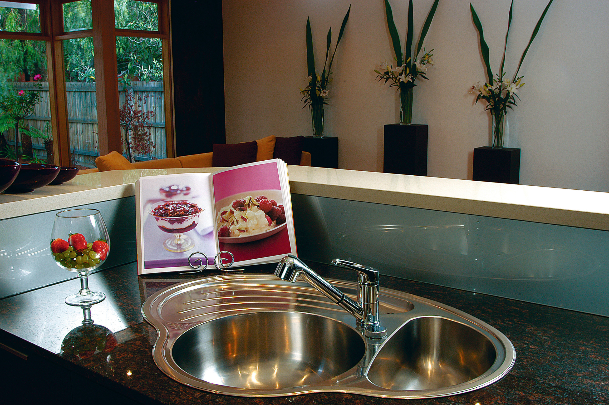 Curved double sink in corner of bench set countertop, furniture, interior design, kitchen, room, table, brown