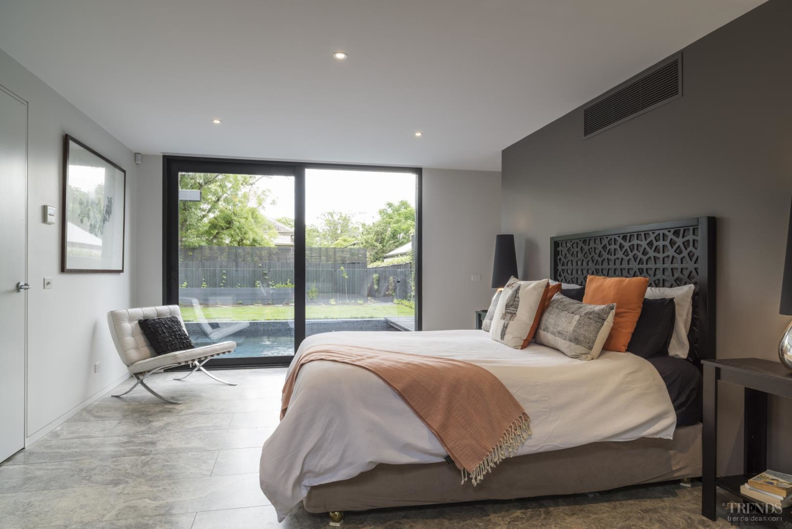 This master bedroom looks out to the home's bed frame, bedroom, ceiling, estate, floor, home, house, interior design, property, real estate, room, window, gray