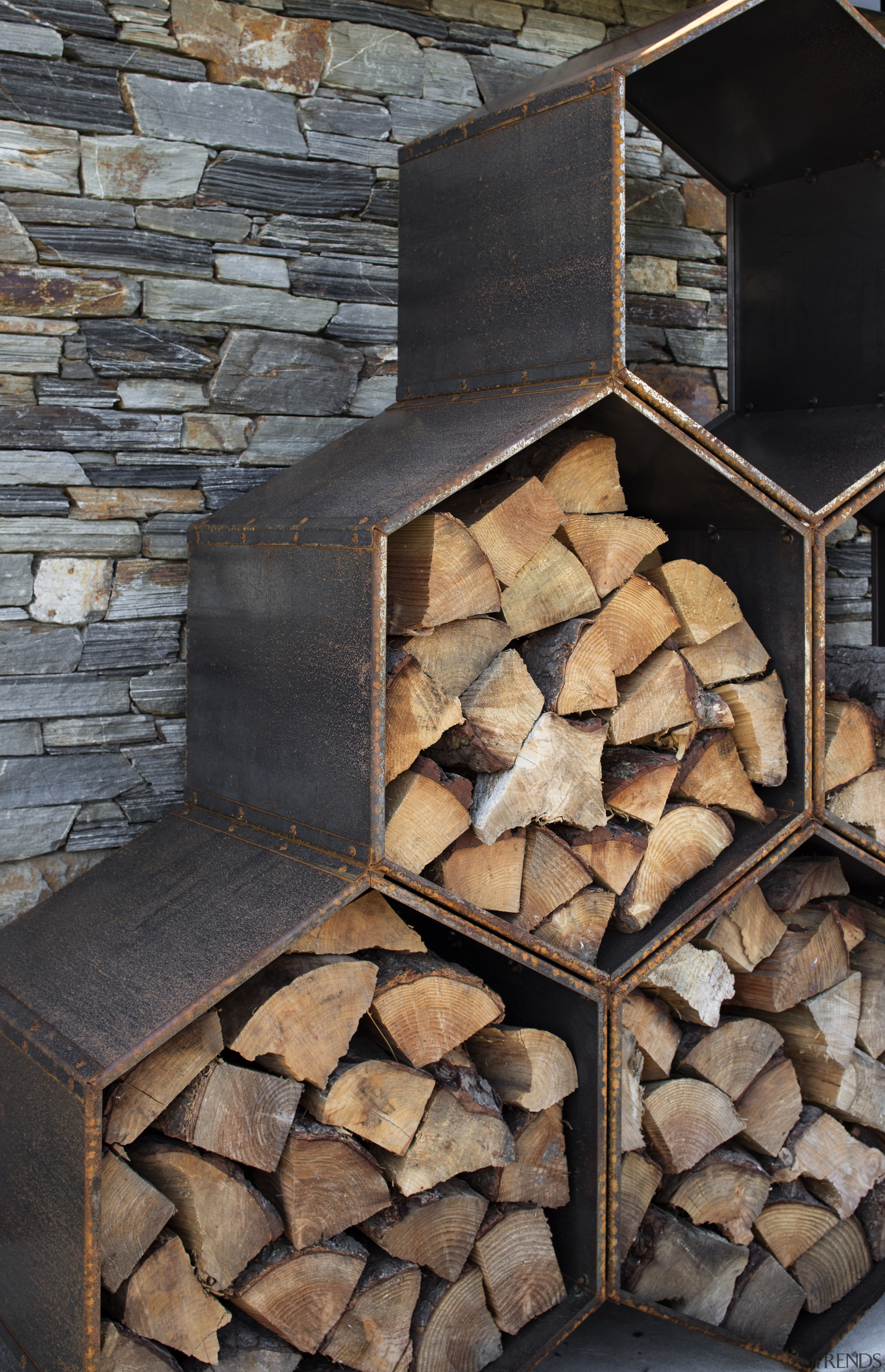 ​​​​​​​Corten steel was an apt material choice for architecture, hearth, rock, wall, firewood, Condon Scott