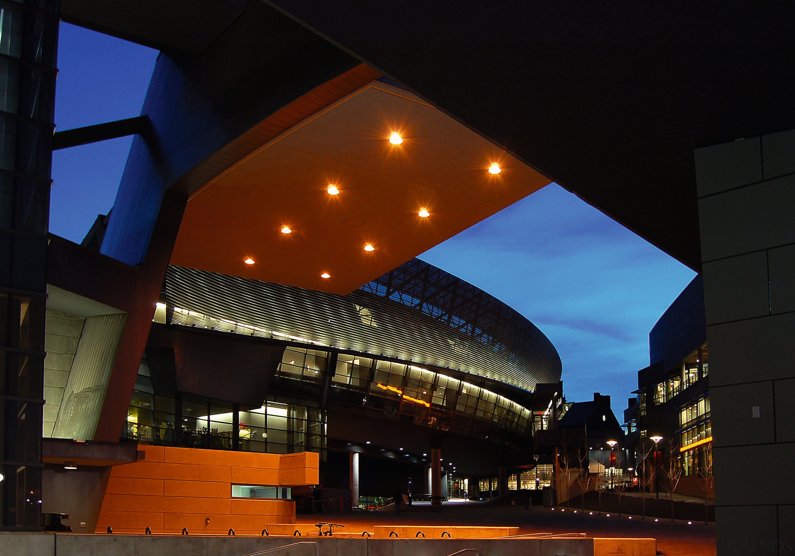 An exterior view of the building. - An architecture, building, city, downtown, evening, landmark, light, lighting, metropolis, metropolitan area, night, performing arts center, reflection, sky, structure, black