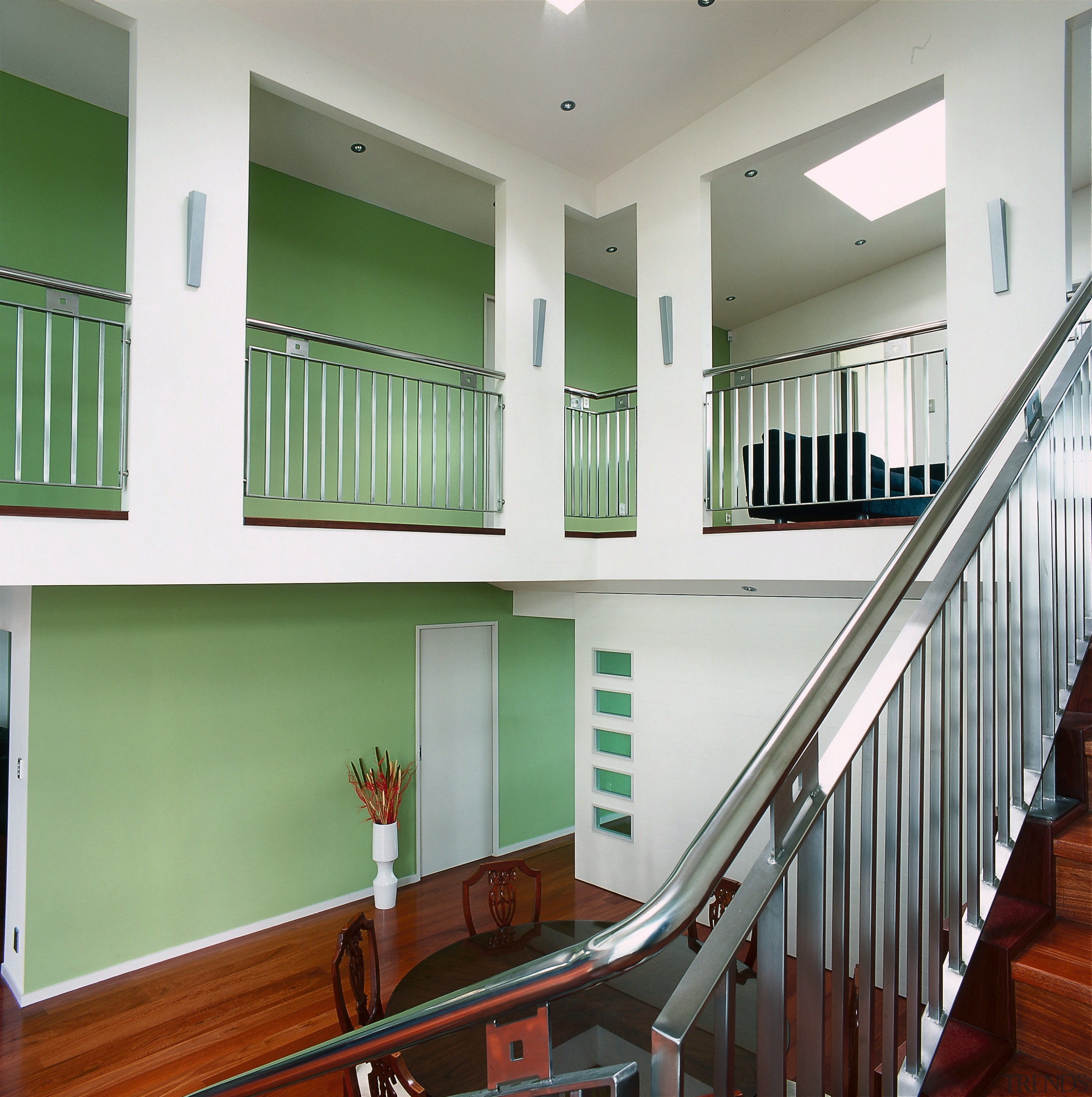 A view of the feature wall painted with architecture, balcony, baluster, daylighting, estate, floor, handrail, home, house, interior design, real estate, stairs, window, gray