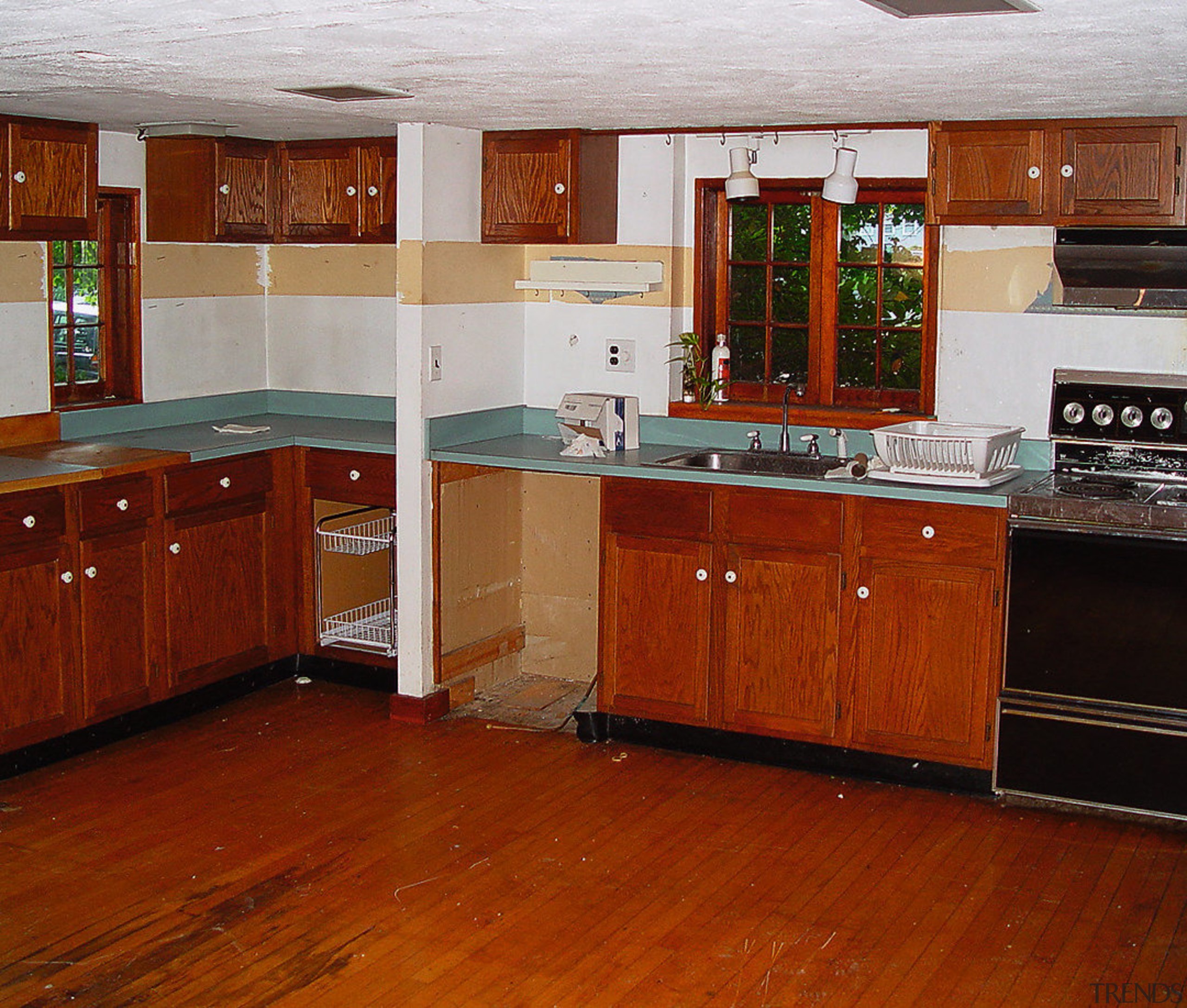 A view of a house by the National cabinetry, countertop, cuisine classique, floor, flooring, hardwood, interior design, kitchen, laminate flooring, room, wood, wood flooring, wood stain, brown