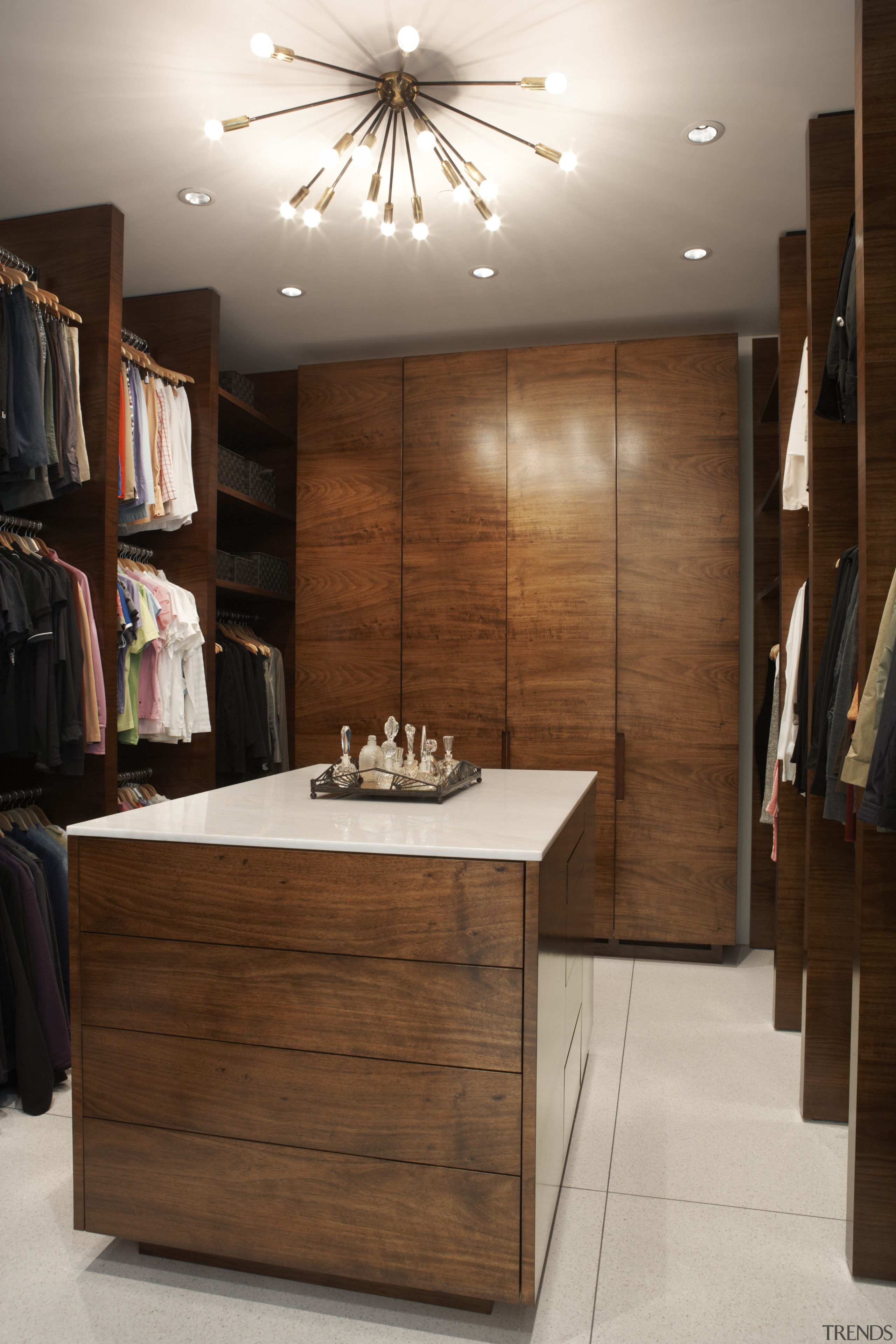 Koa wood features in this walk-in closet in closet, flooring, furniture, interior design, room, table, wood, brown, gray