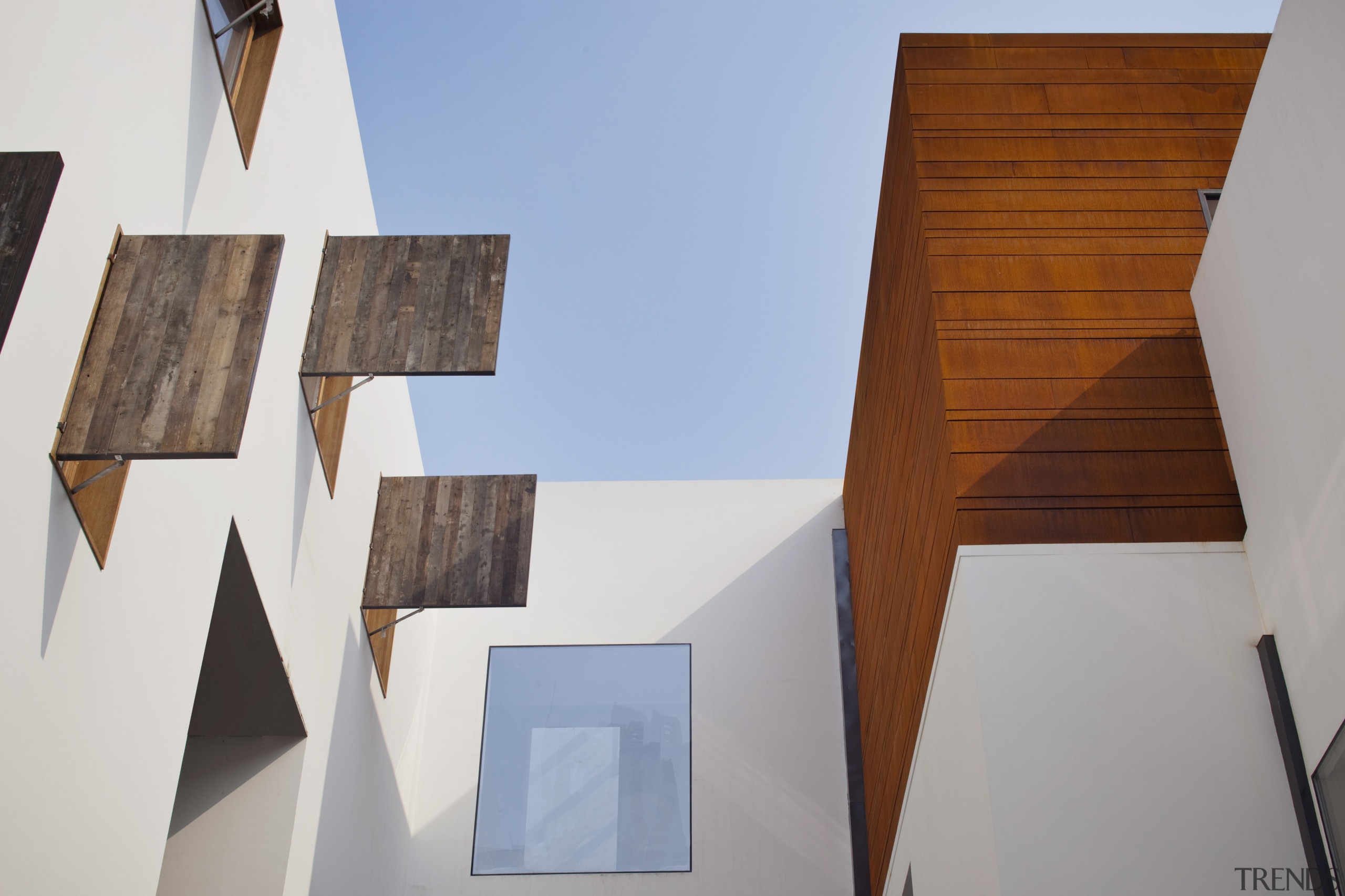 View of a contemporary boutique hotel in Shanghai. architecture, house, product design, wood, white, gray