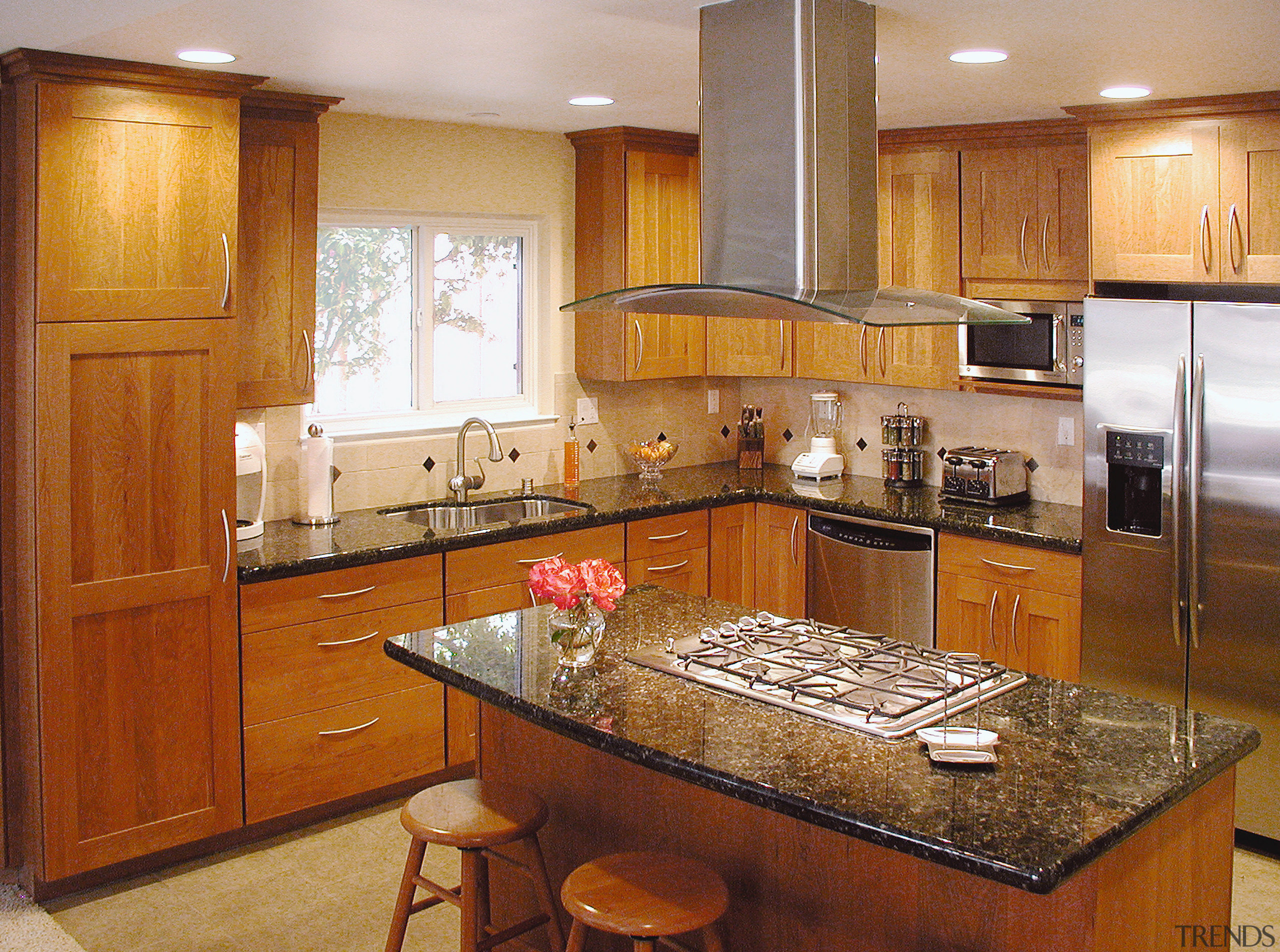 A view of a kitchen designed by NKBA cabinetry, countertop, cuisine classique, hardwood, home, interior design, kitchen, room, brown