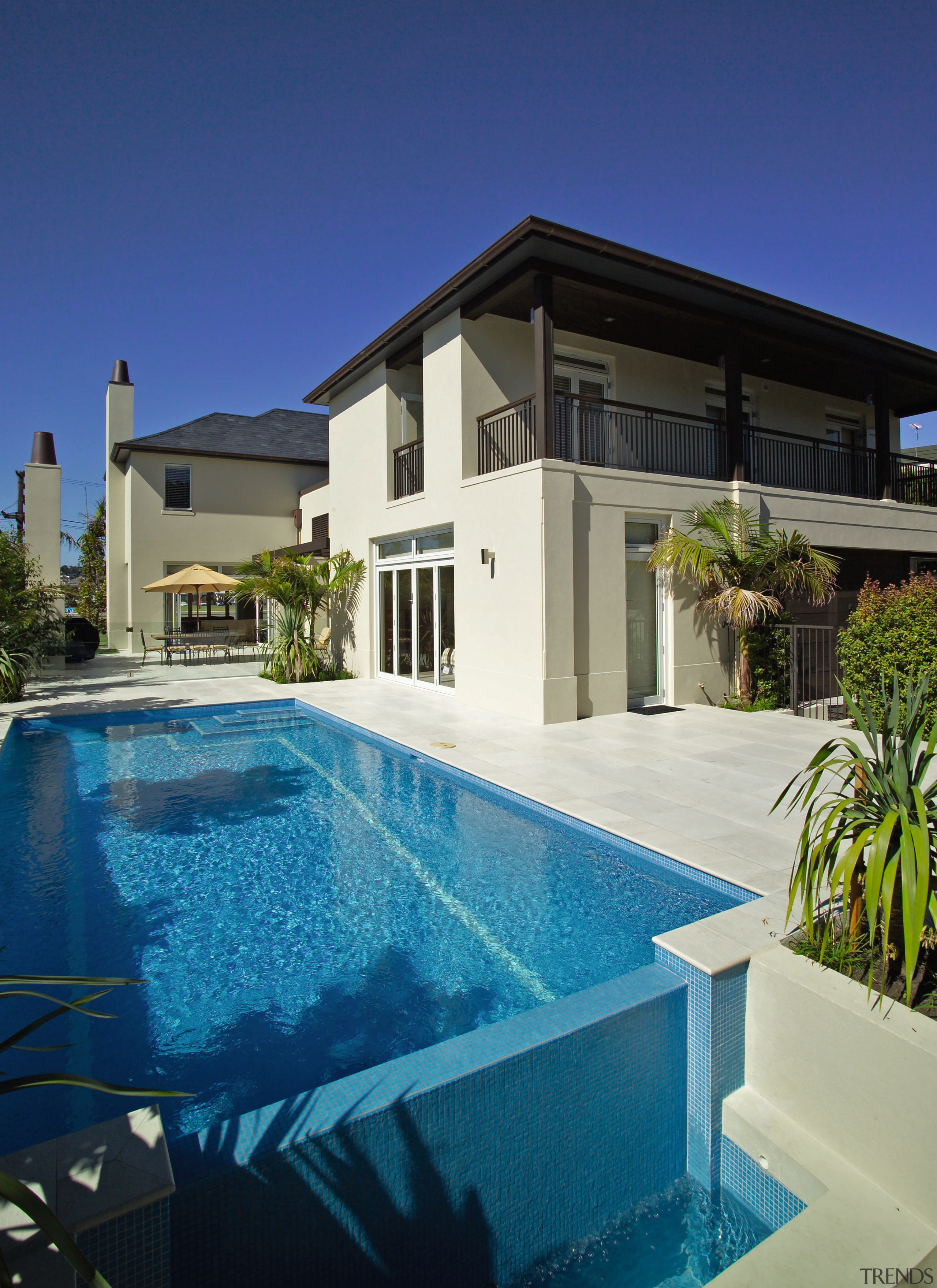 Exterior of masonry home with pool, paving, gardens architecture, condominium, elevation, estate, facade, home, house, mansion, property, real estate, residential area, swimming pool, villa, blue