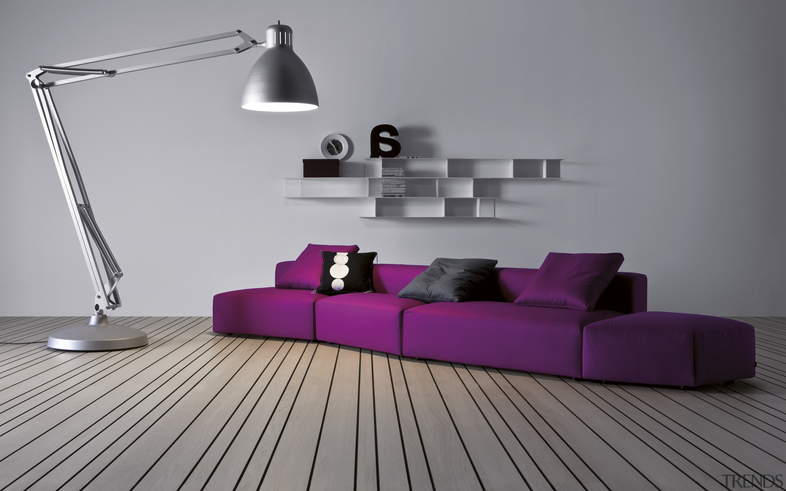 Lounge with purple couch, lamp and contemporary wall angle, couch, floor, flooring, furniture, interior design, lighting, living room, product, product design, purple, table, wall, gray