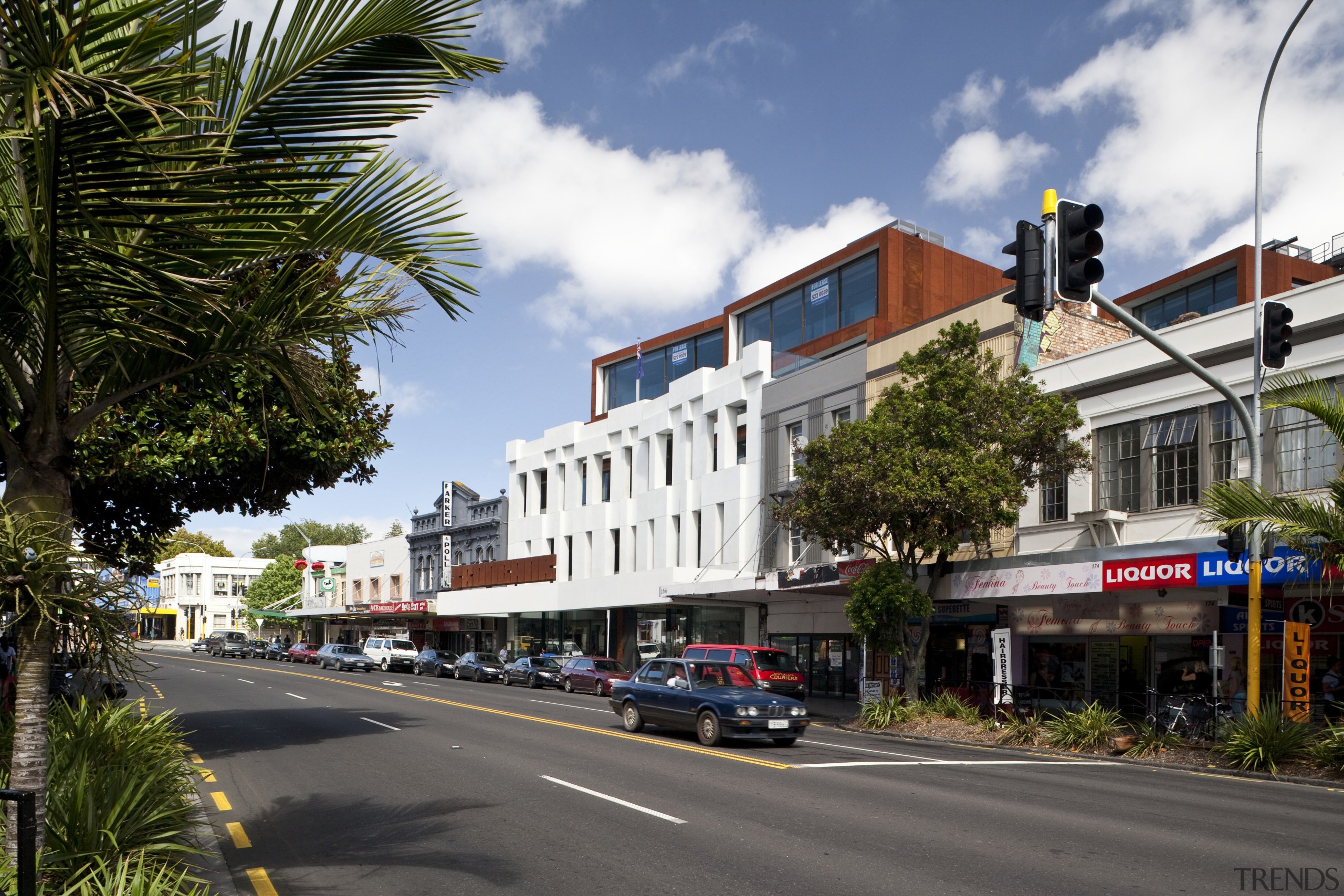 Exterior view of the Ironbank building which features arecales, building, car, city, condominium, downtown, home, house, infrastructure, metropolitan area, mixed use, neighbourhood, palm tree, plant, real estate, residential area, road, sky, street, town, tree, urban area, woody plant