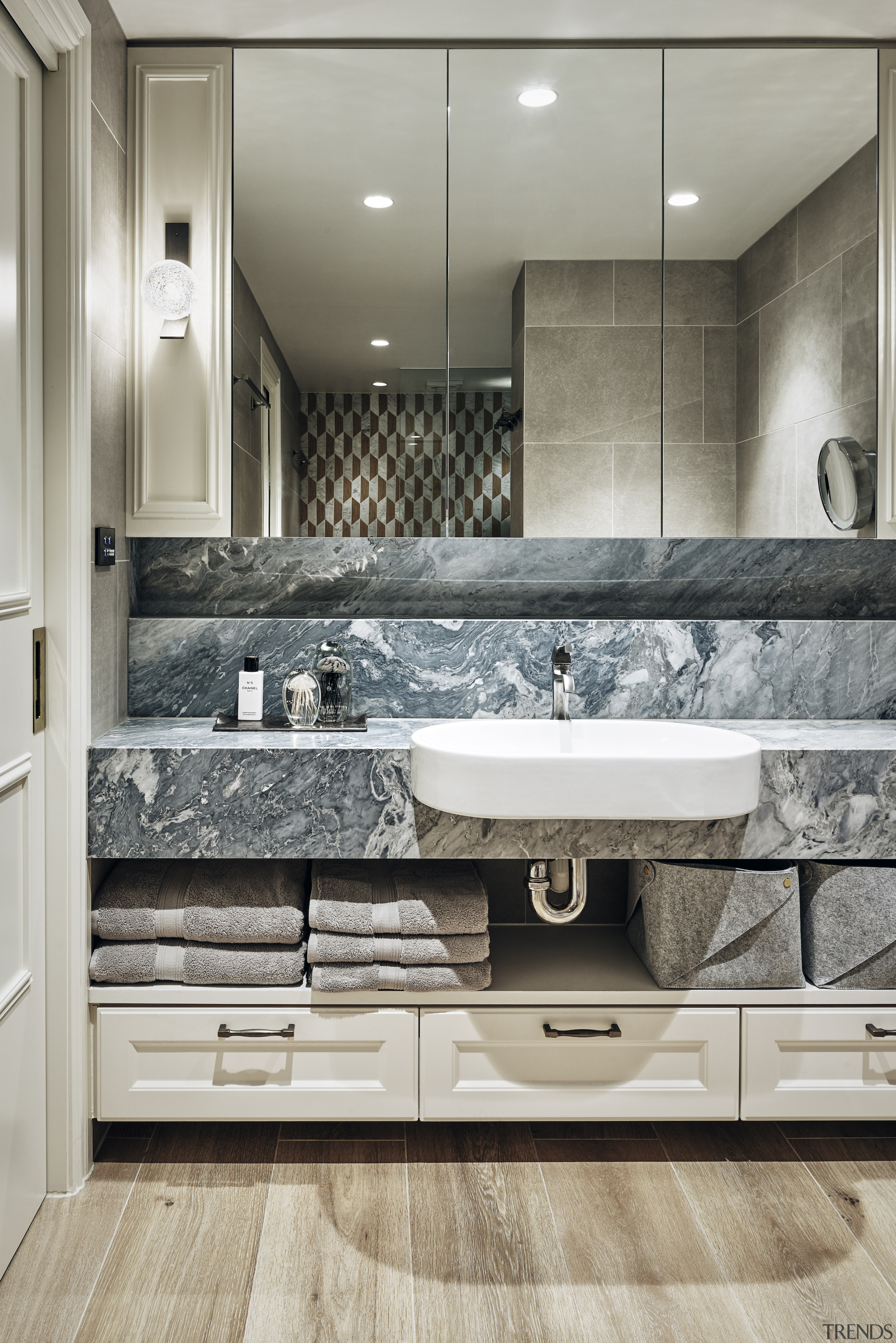 Natural materials, texture, and pattern give the bathroom 