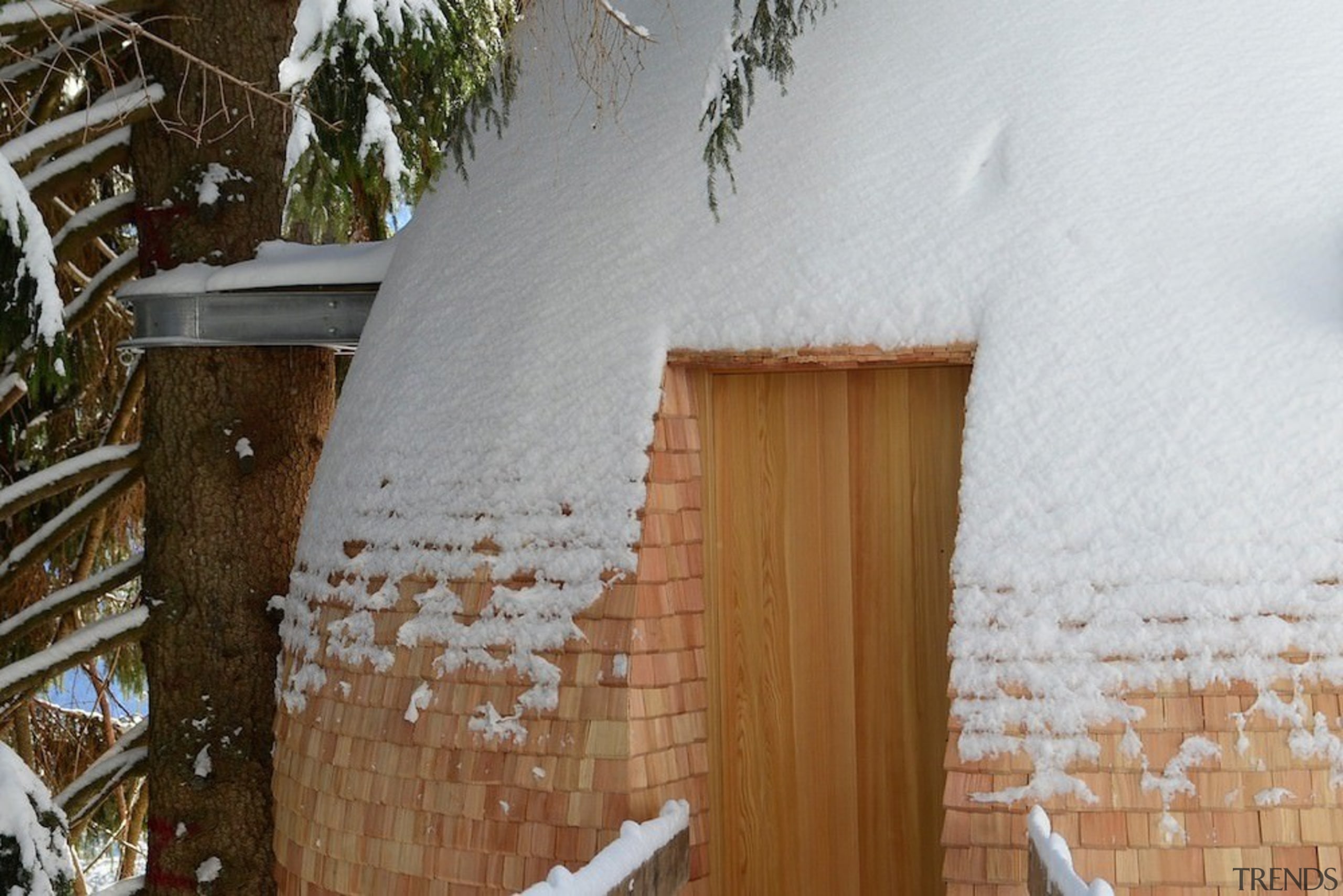 A recessed door means little chance of getting architecture, facade, freezing, home, house, property, roof, snow, wall, window, winter, wood, brown, gray