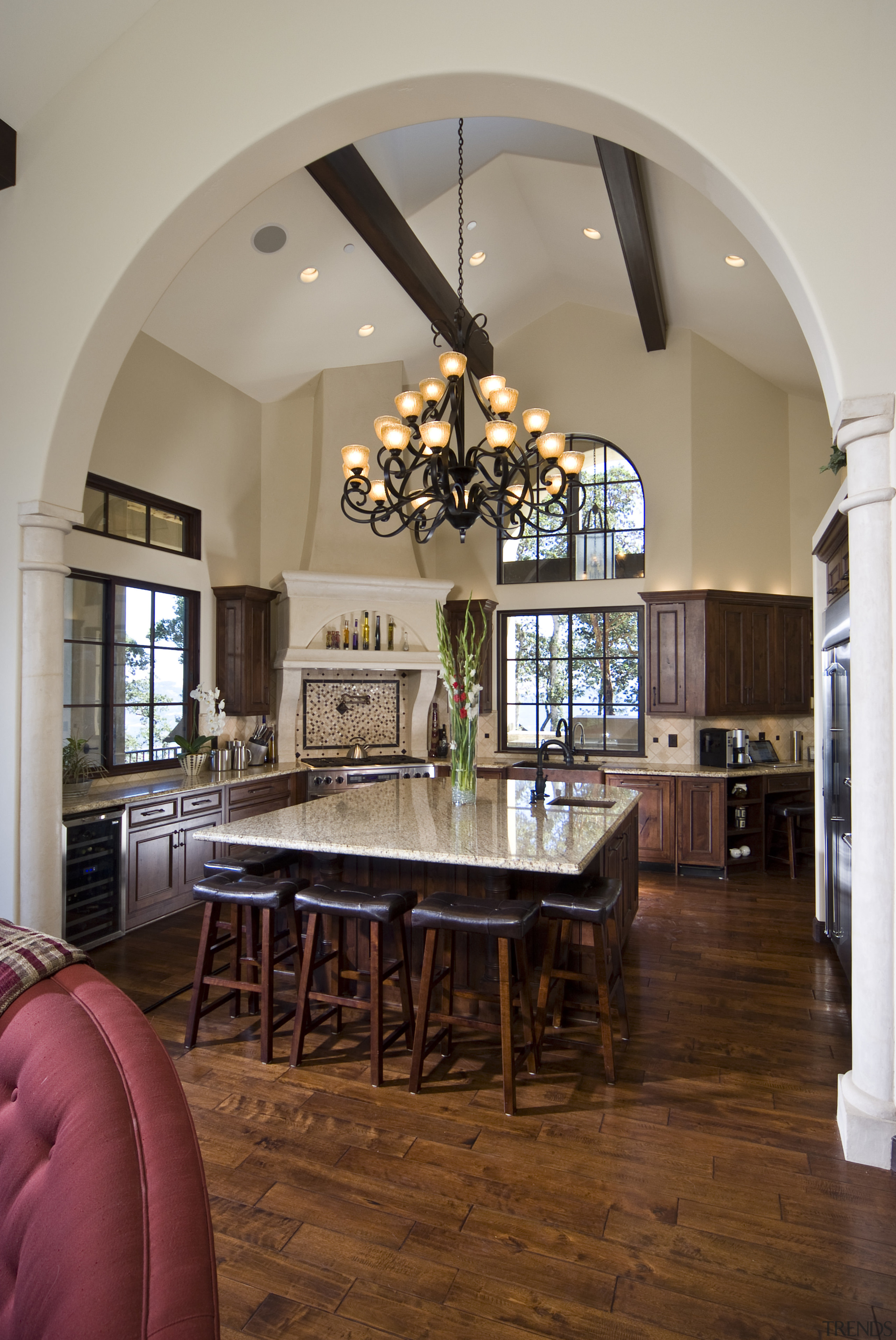 View of a Tuscan-styled kitchen which features dark-stained ceiling, dining room, estate, floor, flooring, furniture, hardwood, home, interior design, living room, real estate, room, table, window, wood flooring, gray, brown