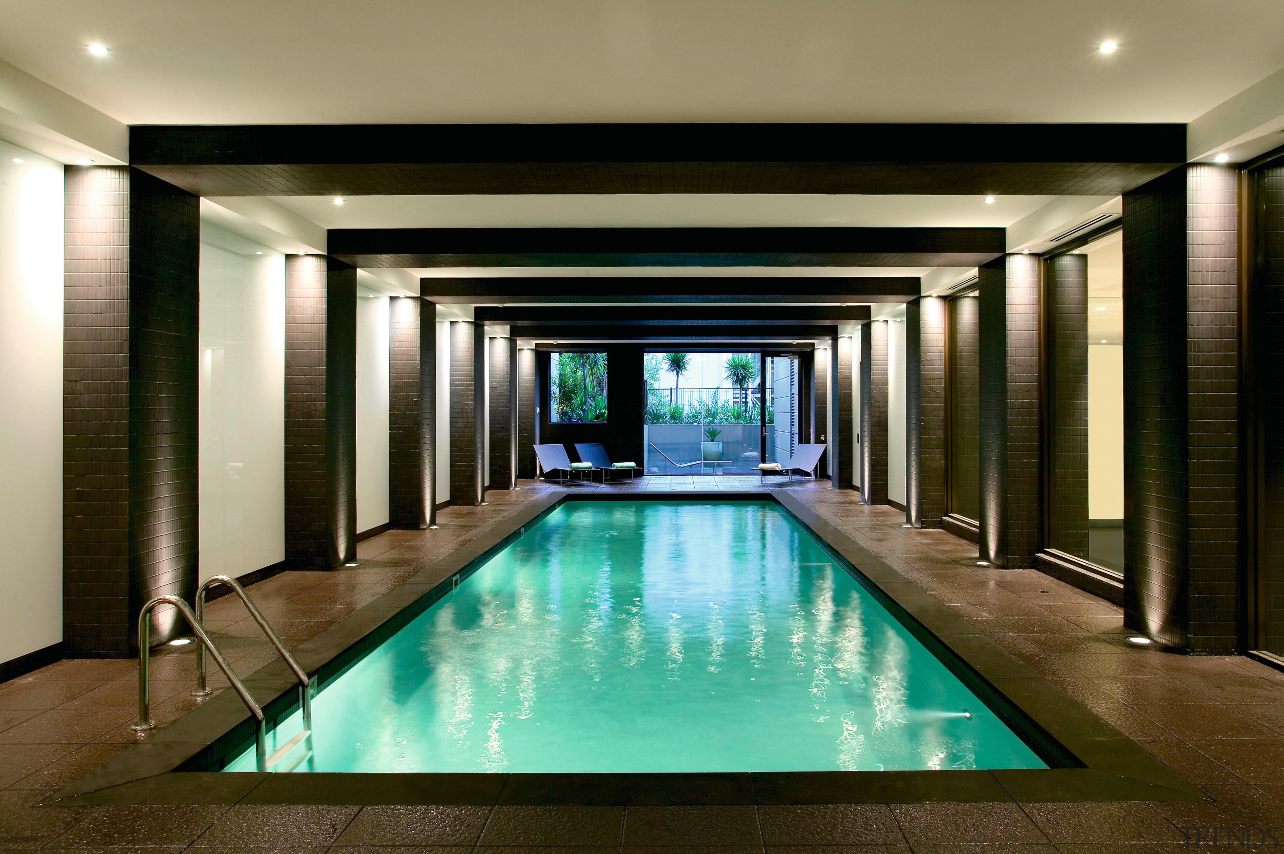 View of the indoor swimming pool - View interior design, lighting, lobby, property, real estate, swimming pool, brown