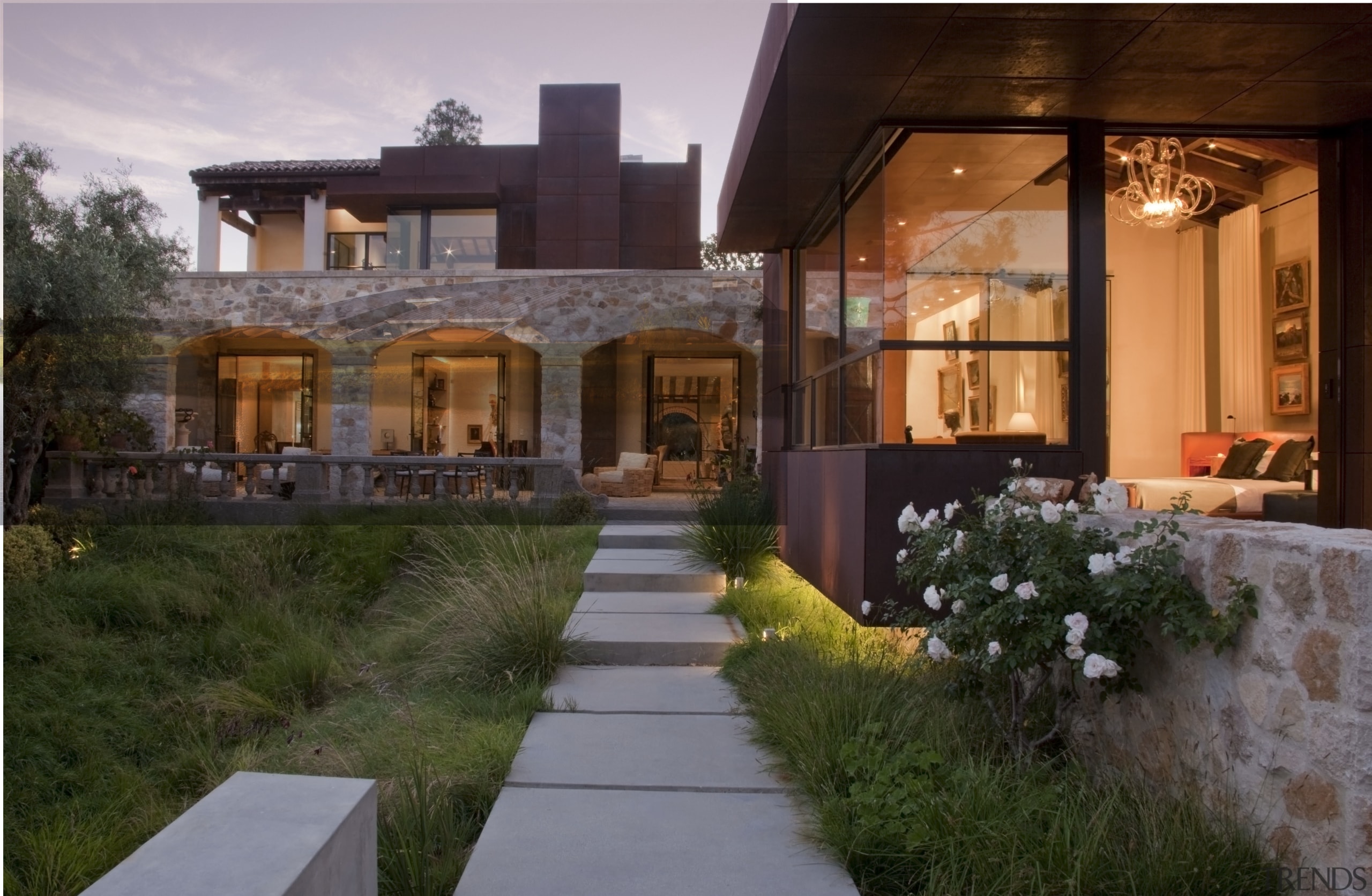 View of entrance to the home. Windows and architecture, backyard, courtyard, estate, facade, home, house, landscape, landscape lighting, landscaping, lighting, patio, property, real estate, residential area, siding, window, yard, brown, gray