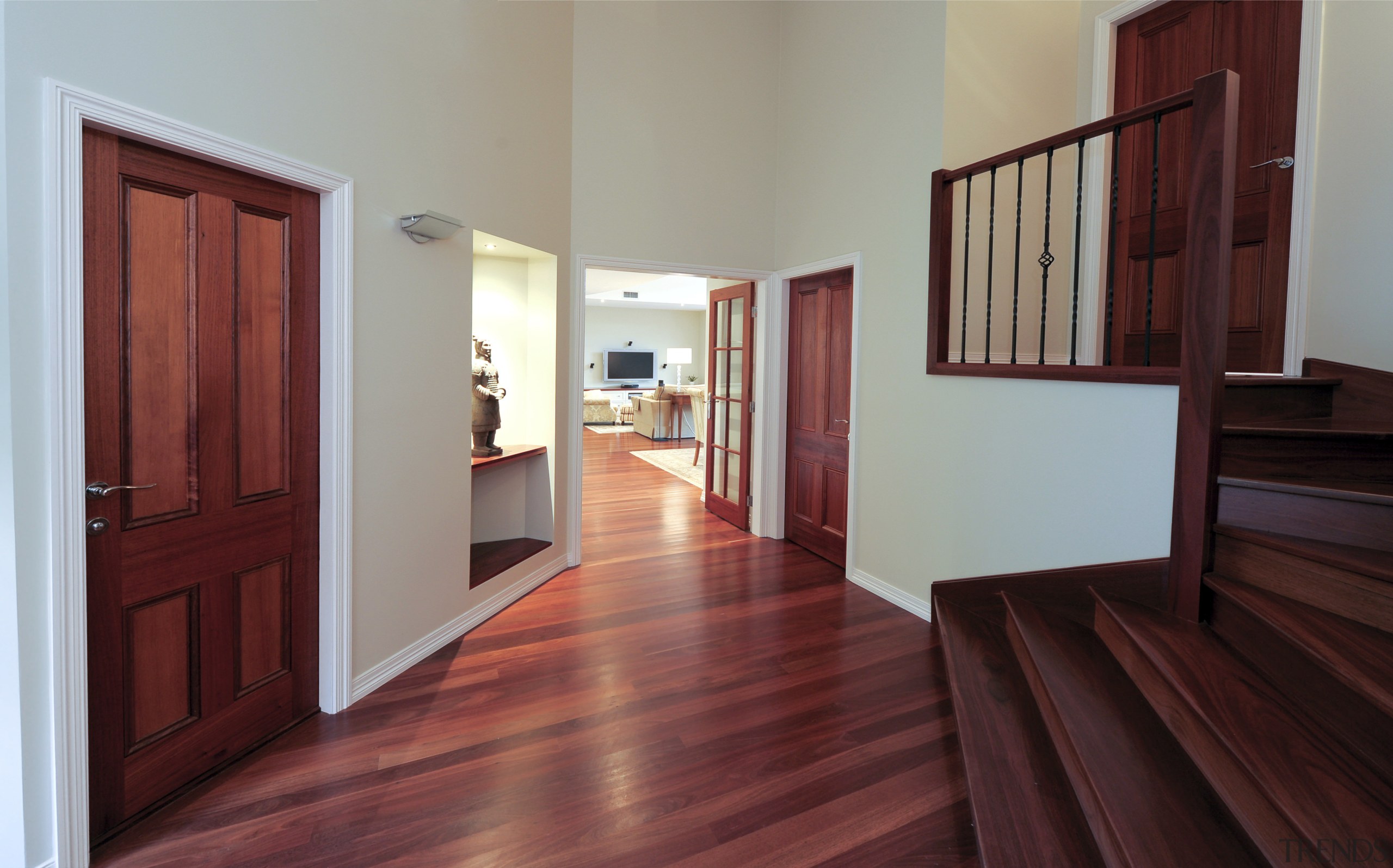 Interior stairway view of a remodelled house. Designed door, estate, floor, flooring, hardwood, home, house, interior design, laminate flooring, property, real estate, room, window, wood, wood flooring, wood stain, red, gray