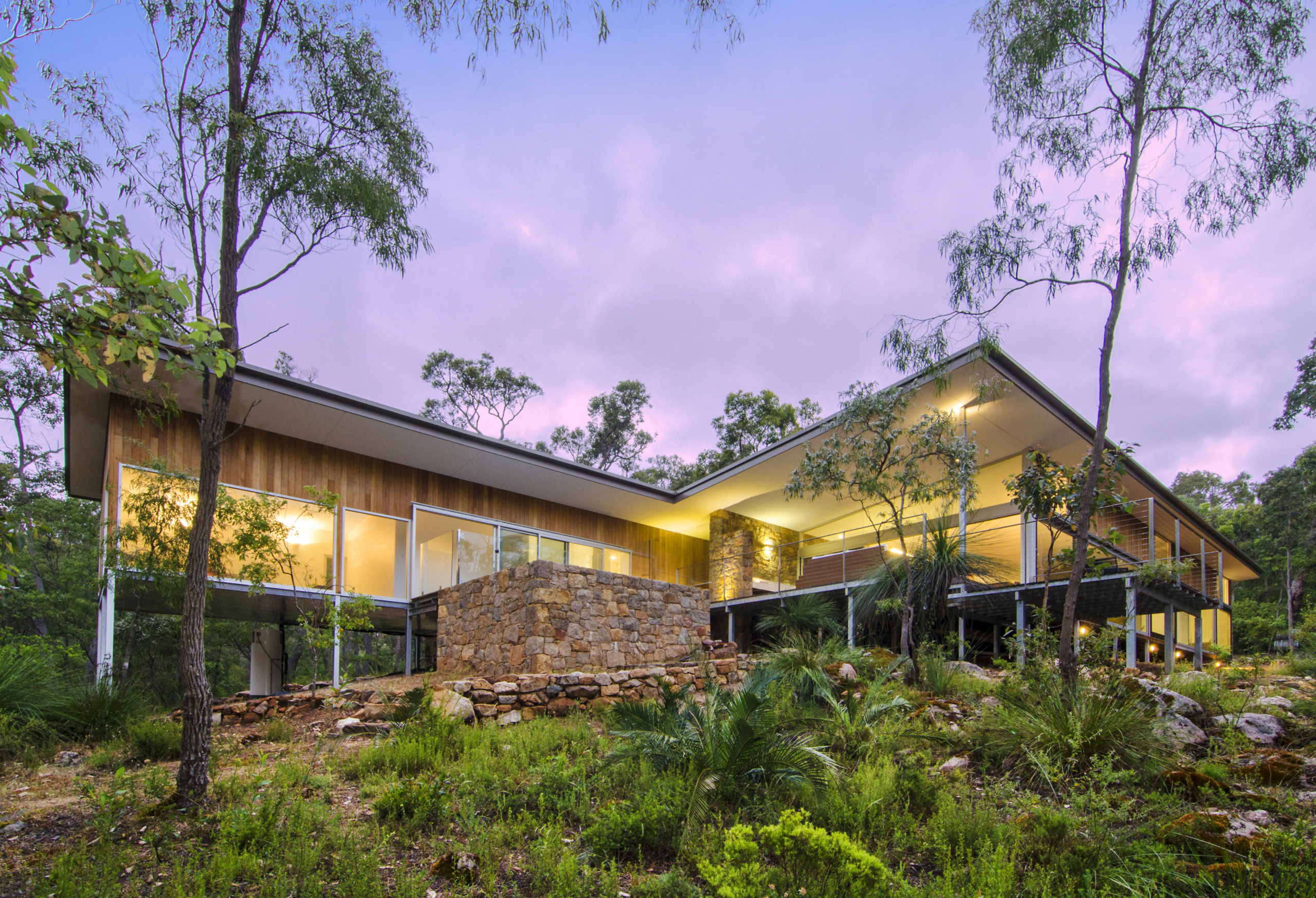 Local stone and Pacific teak feature on this architecture, cottage, estate, facade, home, house, landscape, property, real estate, sky, brown, purple