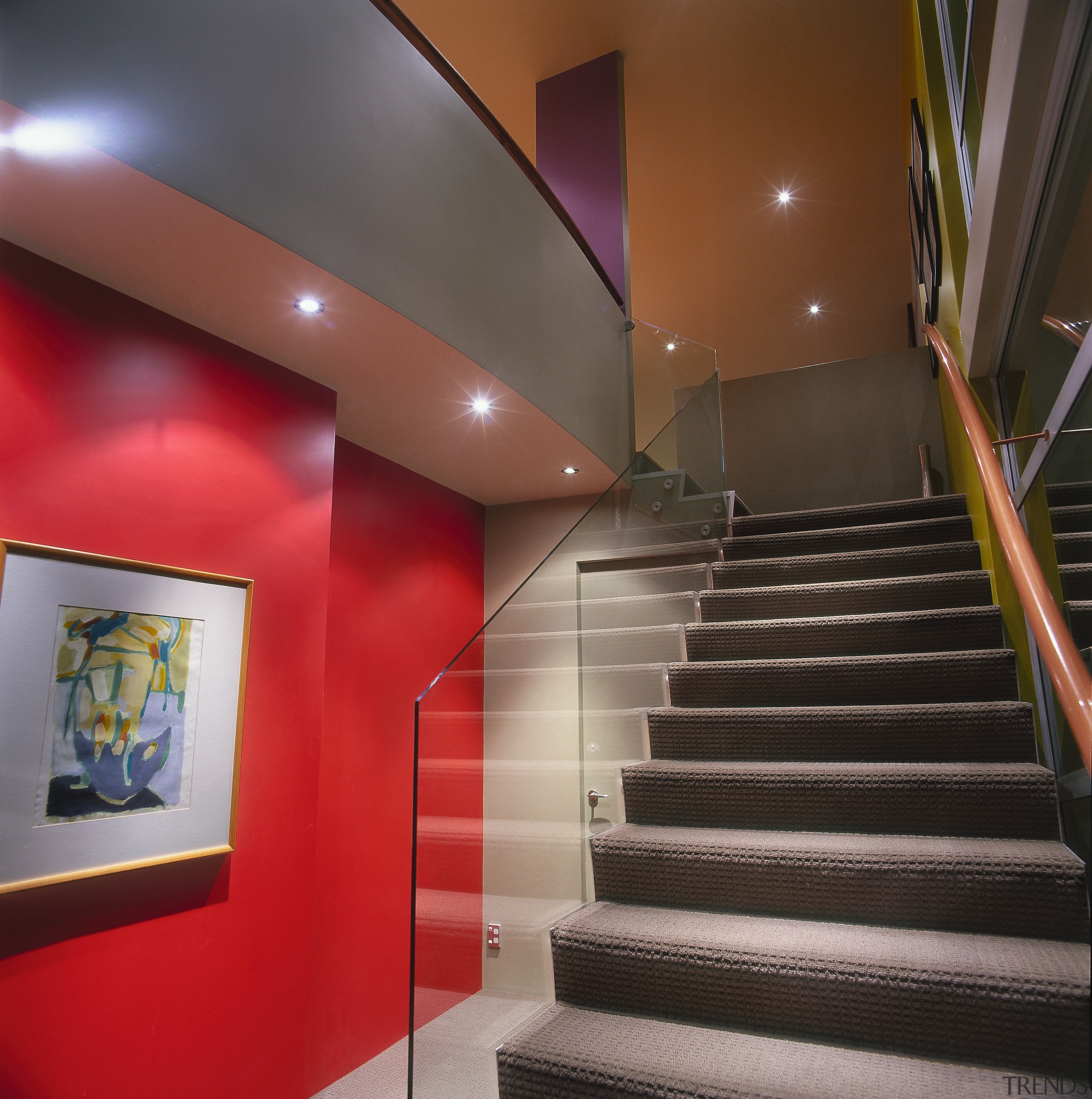 A view of the stairway, glass railing, grey architecture, ceiling, daylighting, handrail, interior design, lobby, real estate, stairs, wall, black, gray