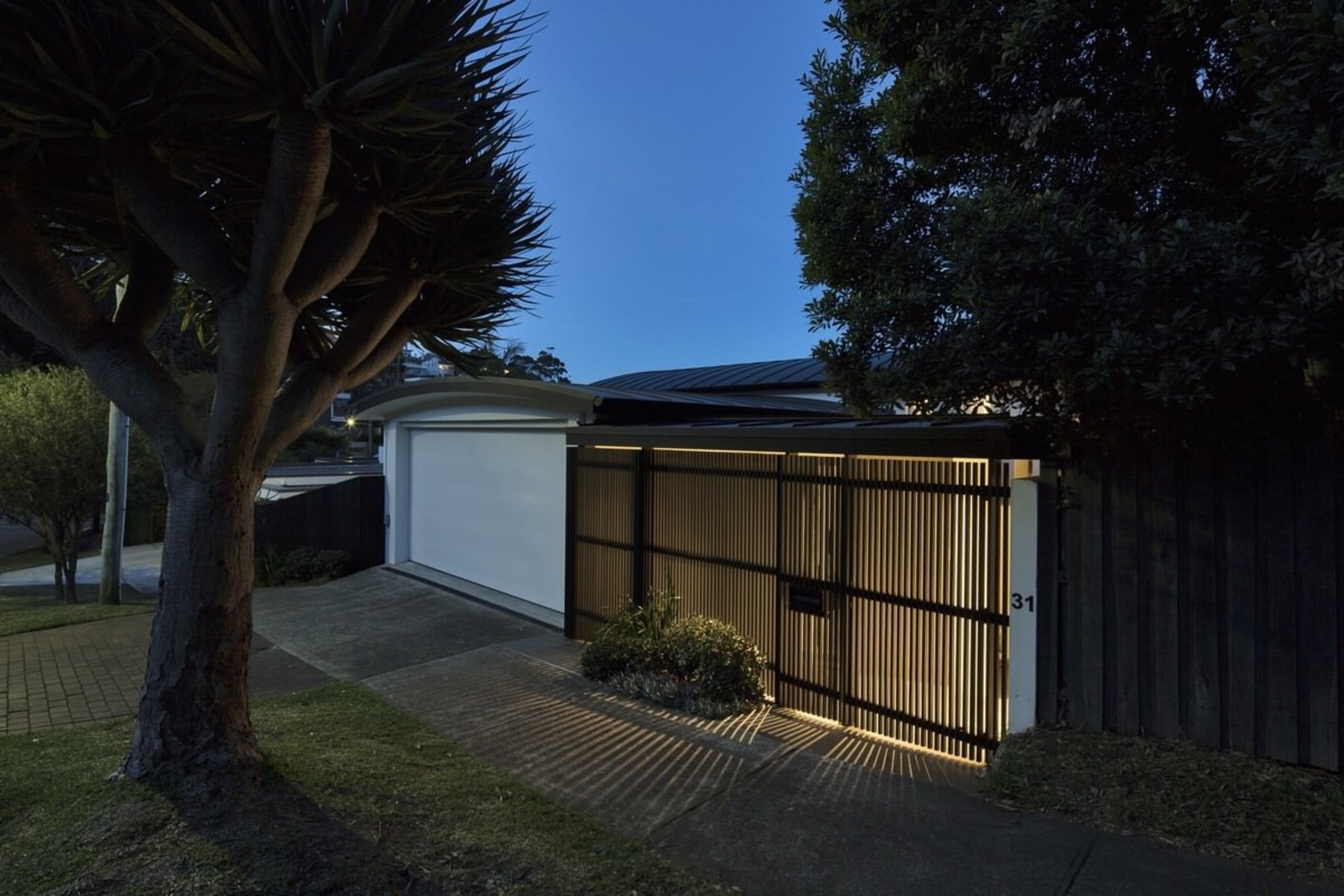 It's certainly a private home from the street architecture, cottage, estate, facade, home, house, lighting, property, real estate, residential area, roof, shed, sky, tree, black