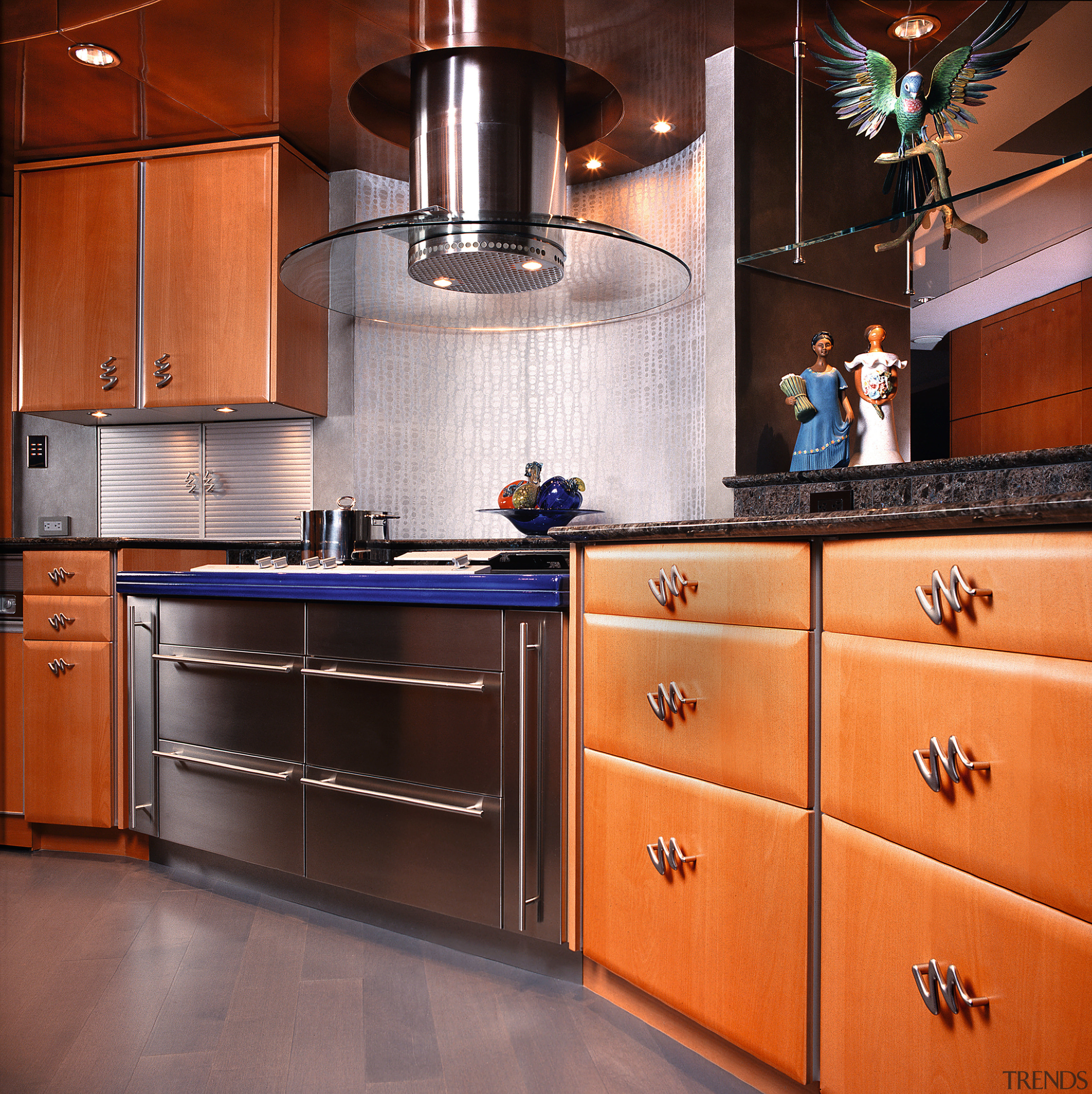 Inner view of the kitchen cabinetry &amp; appliances cabinetry, countertop, cuisine classique, flooring, hardwood, home appliance, interior design, kitchen, kitchen stove, room, under cabinet lighting, orange