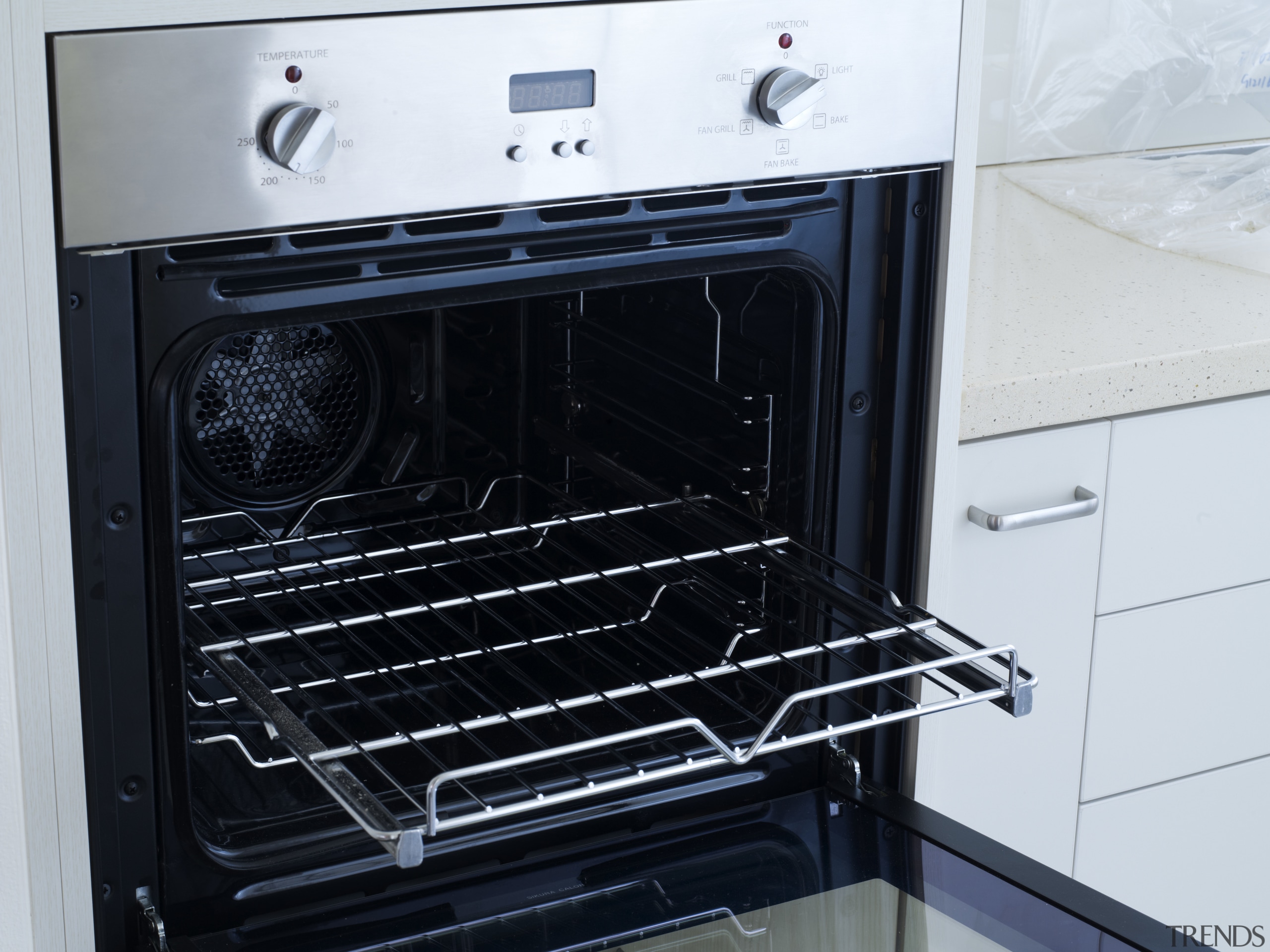 View of the kitchen of a unit at gas stove, home appliance, kitchen appliance, kitchen stove, major appliance, oven, black, white