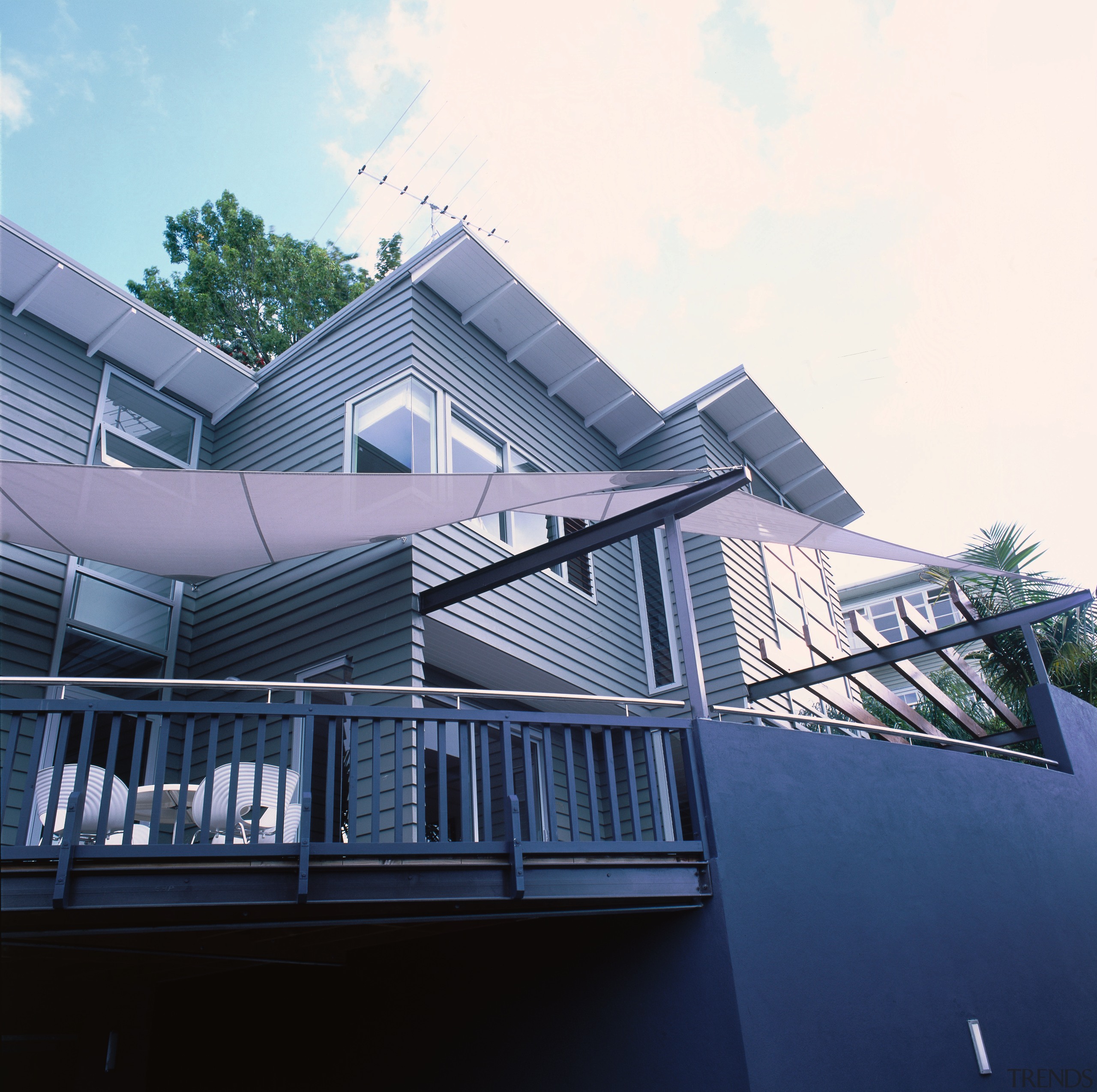 exterior view of deck and living area - architecture, building, commercial building, daylighting, elevation, facade, house, residential area, roof, structure, blue, white