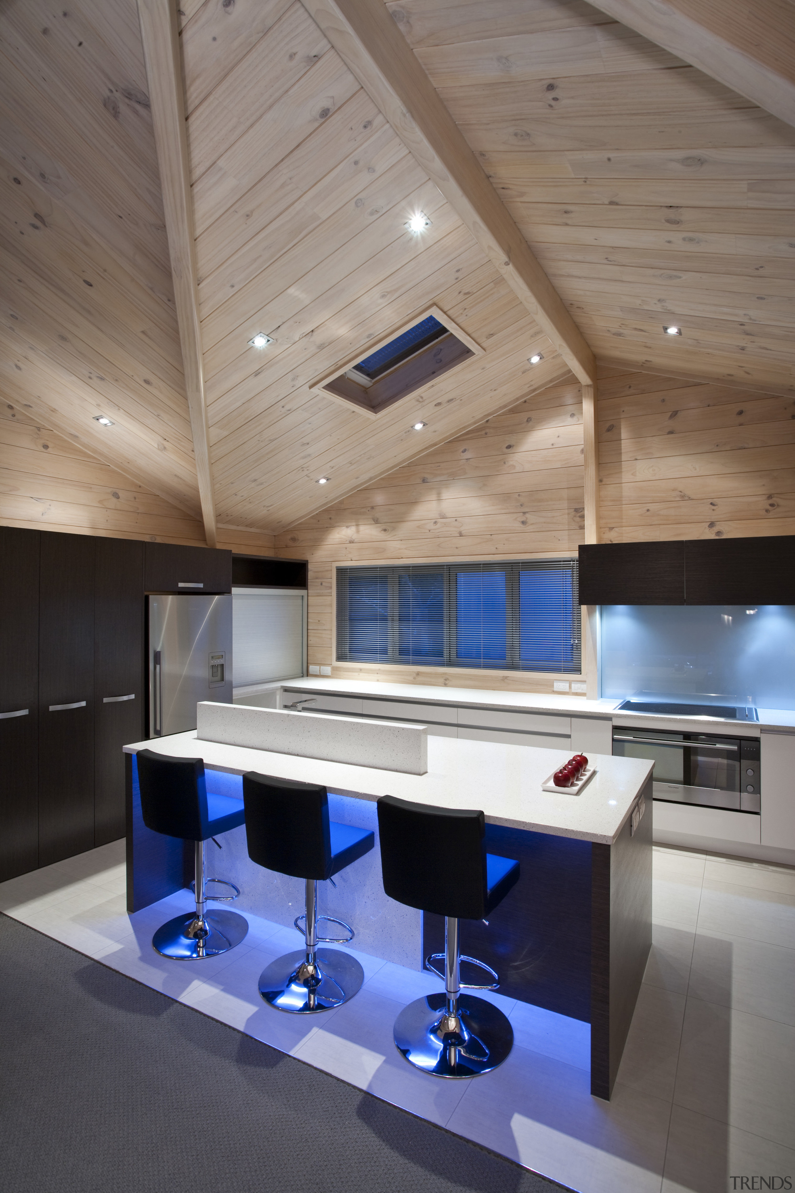 View of the contemporary kitchen area which features architecture, ceiling, daylighting, floor, furniture, house, interior design, table, gray