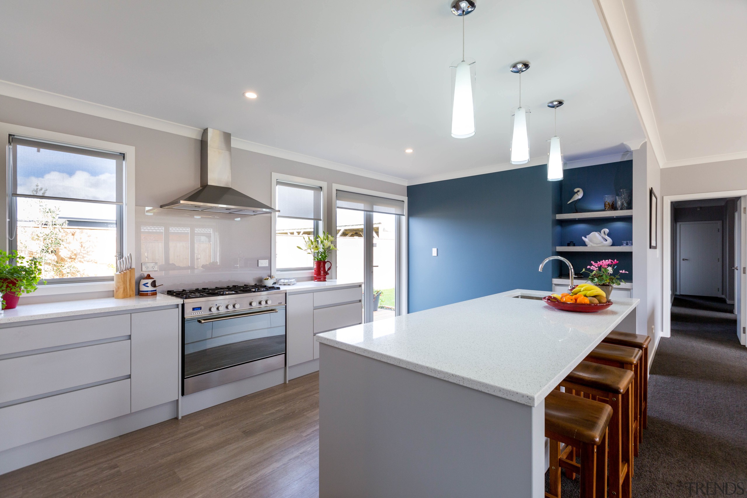 A feature wall in a smoky grey-blue shade countertop, cuisine classique, interior design, kitchen, real estate, room, gray