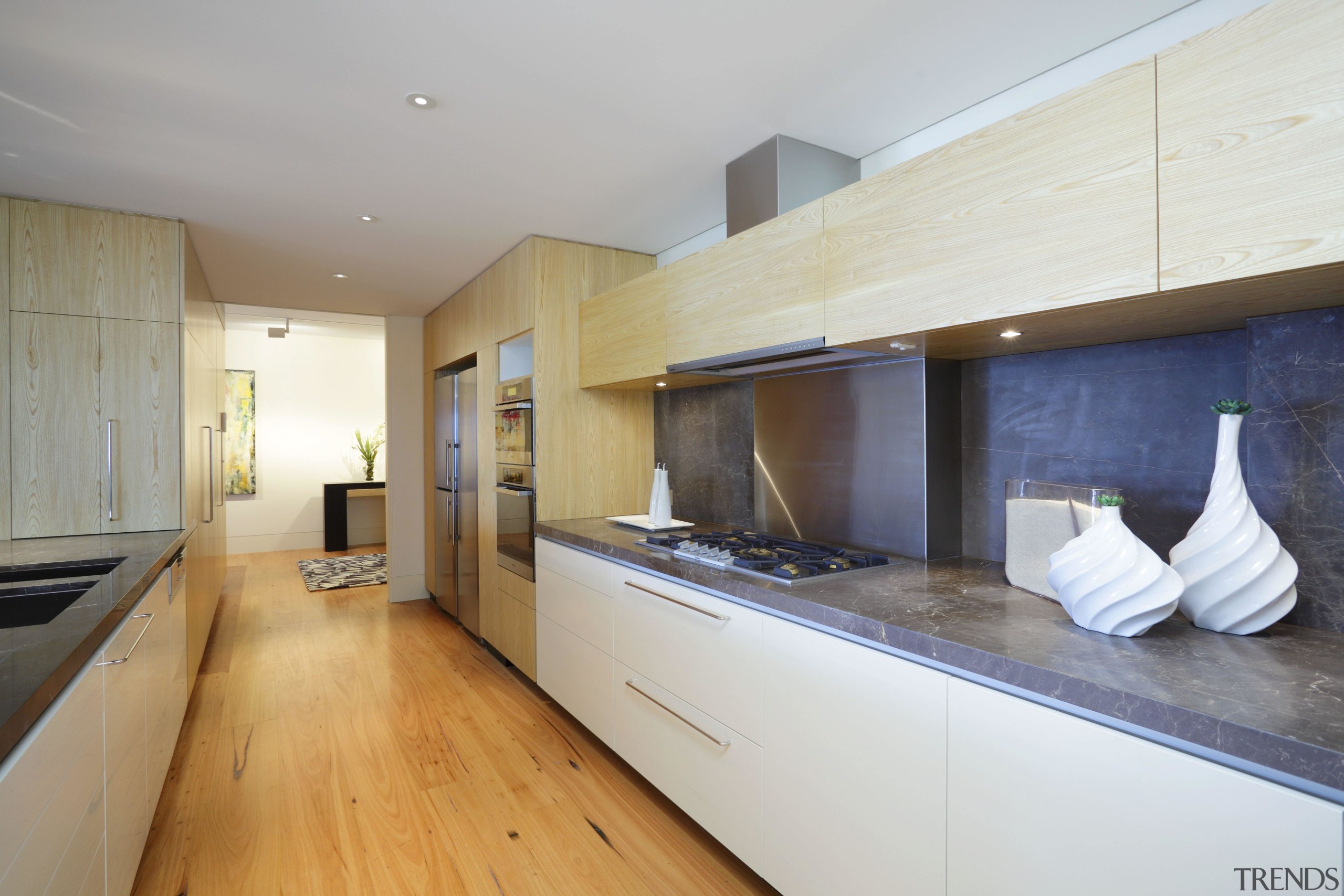 View of the kitchen area which features timber countertop, floor, flooring, interior design, kitchen, property, real estate, room, wood flooring, gray