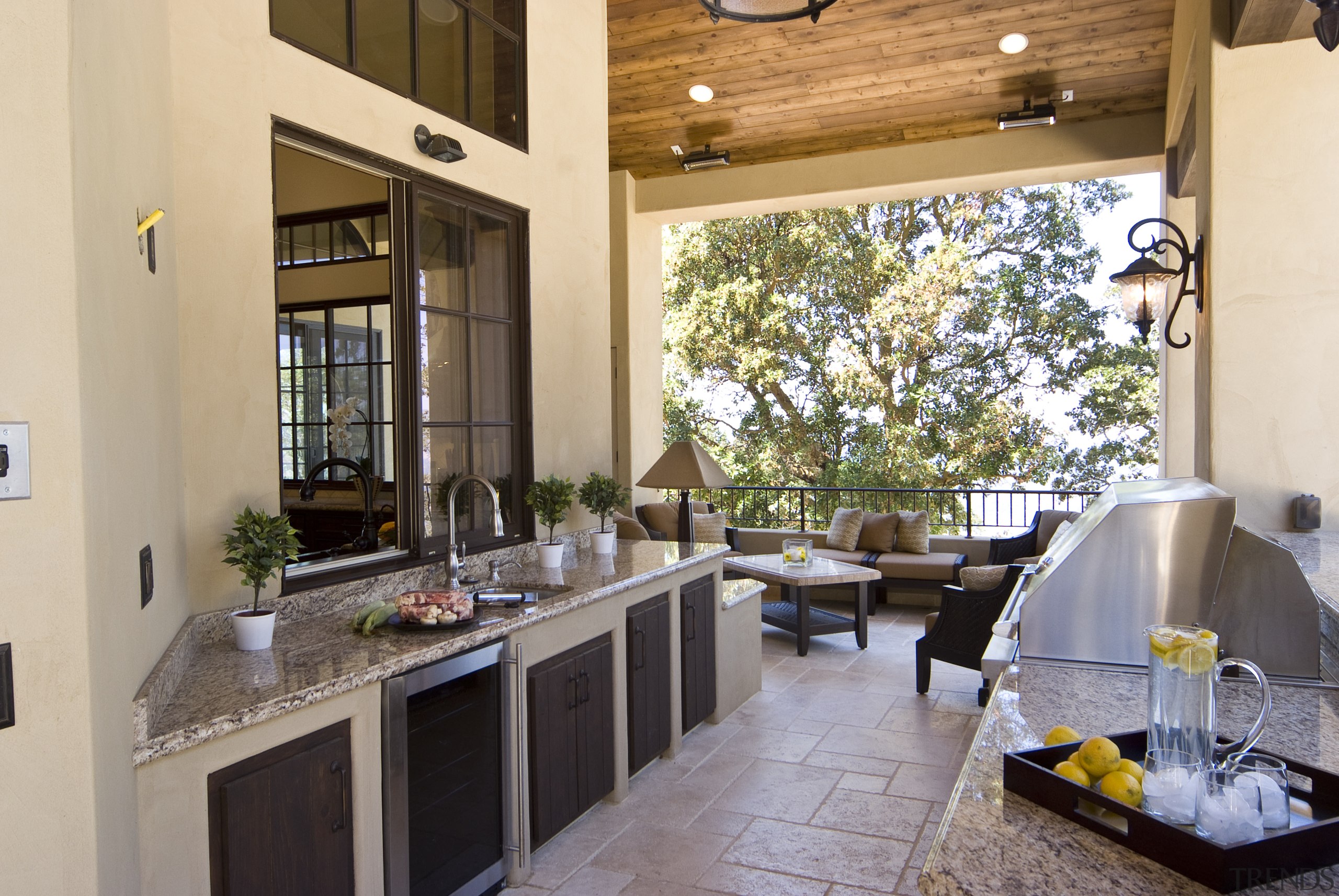 View of outdoor kitchen which features Viking barbeque, countertop, home, interior design, kitchen, property, real estate, window, orange