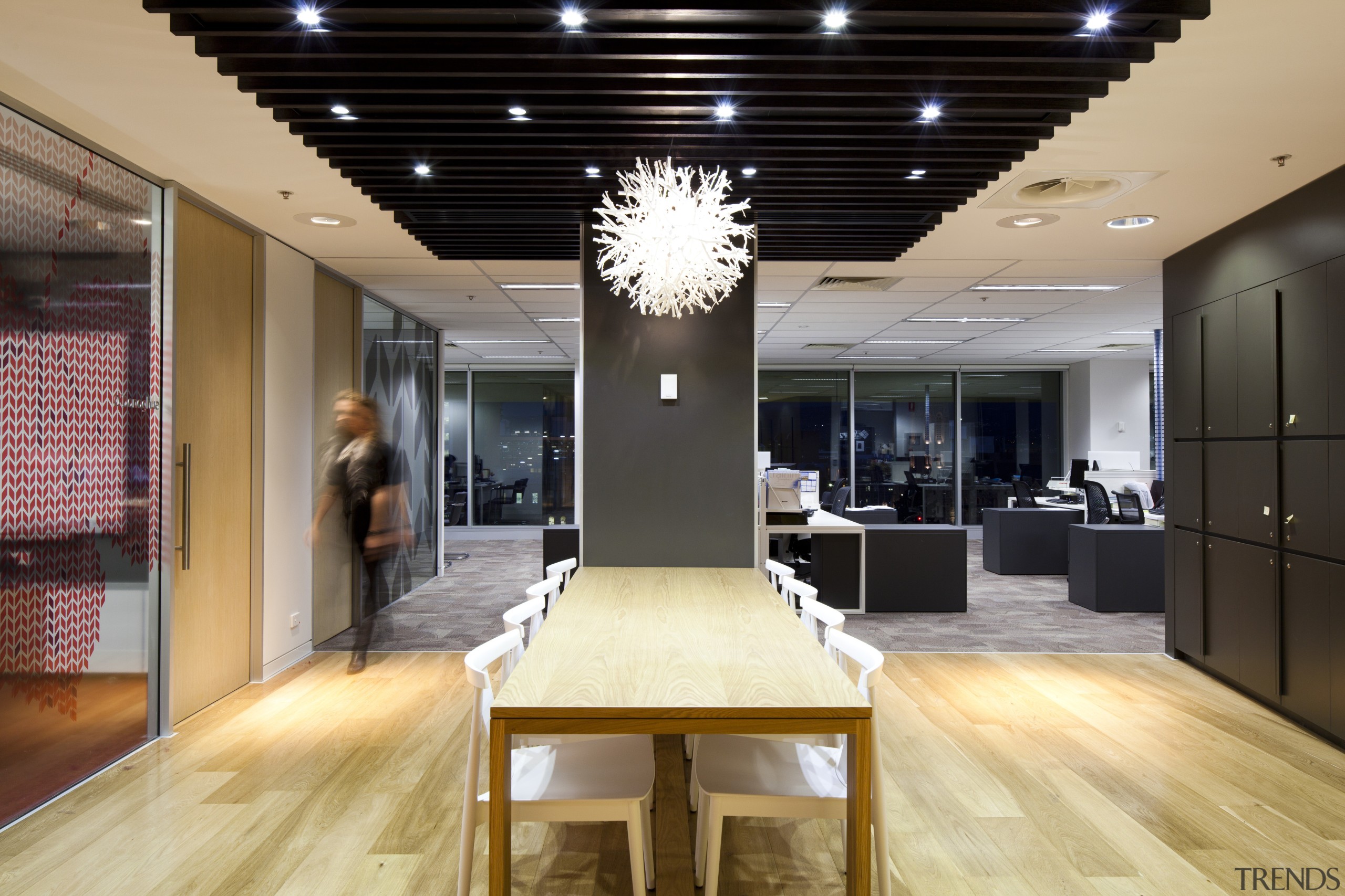 Natural materials are used throughout the design. Oak ceiling, flooring, interior design, lobby, black, orange