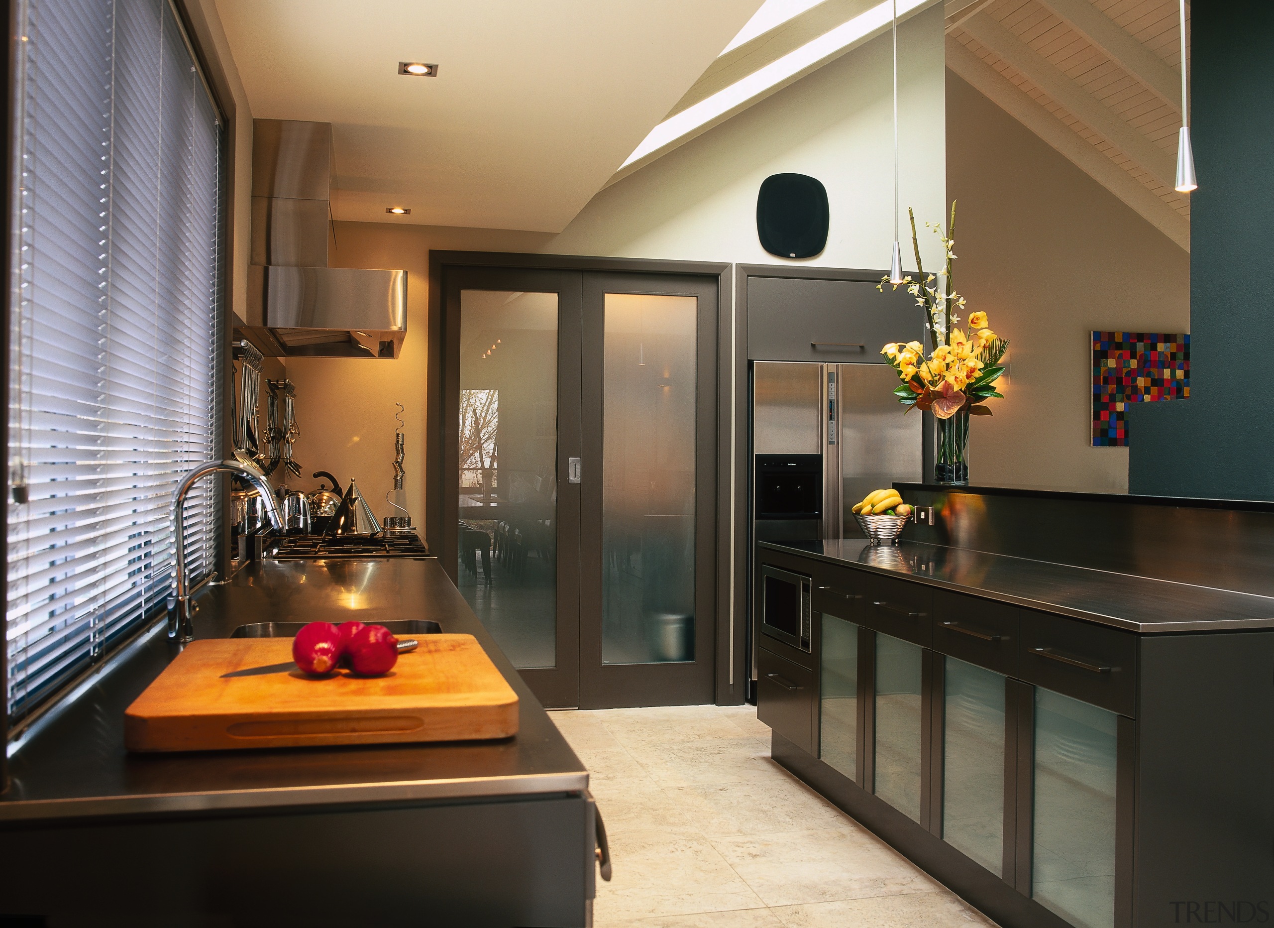 The view of a kitchen with a simple countertop, interior design, kitchen, real estate, black