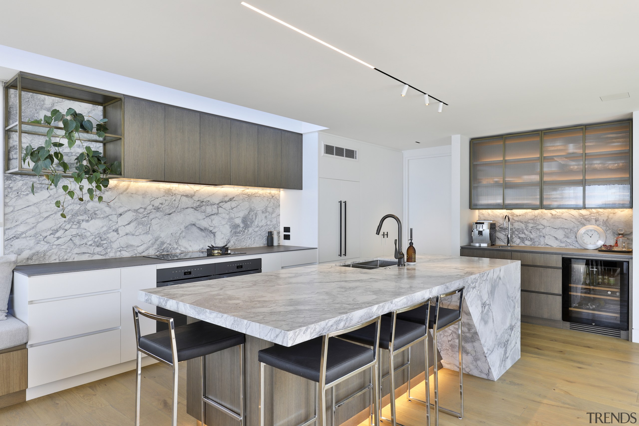 Reeded glass cabinet fronts, open shelving and concealed 