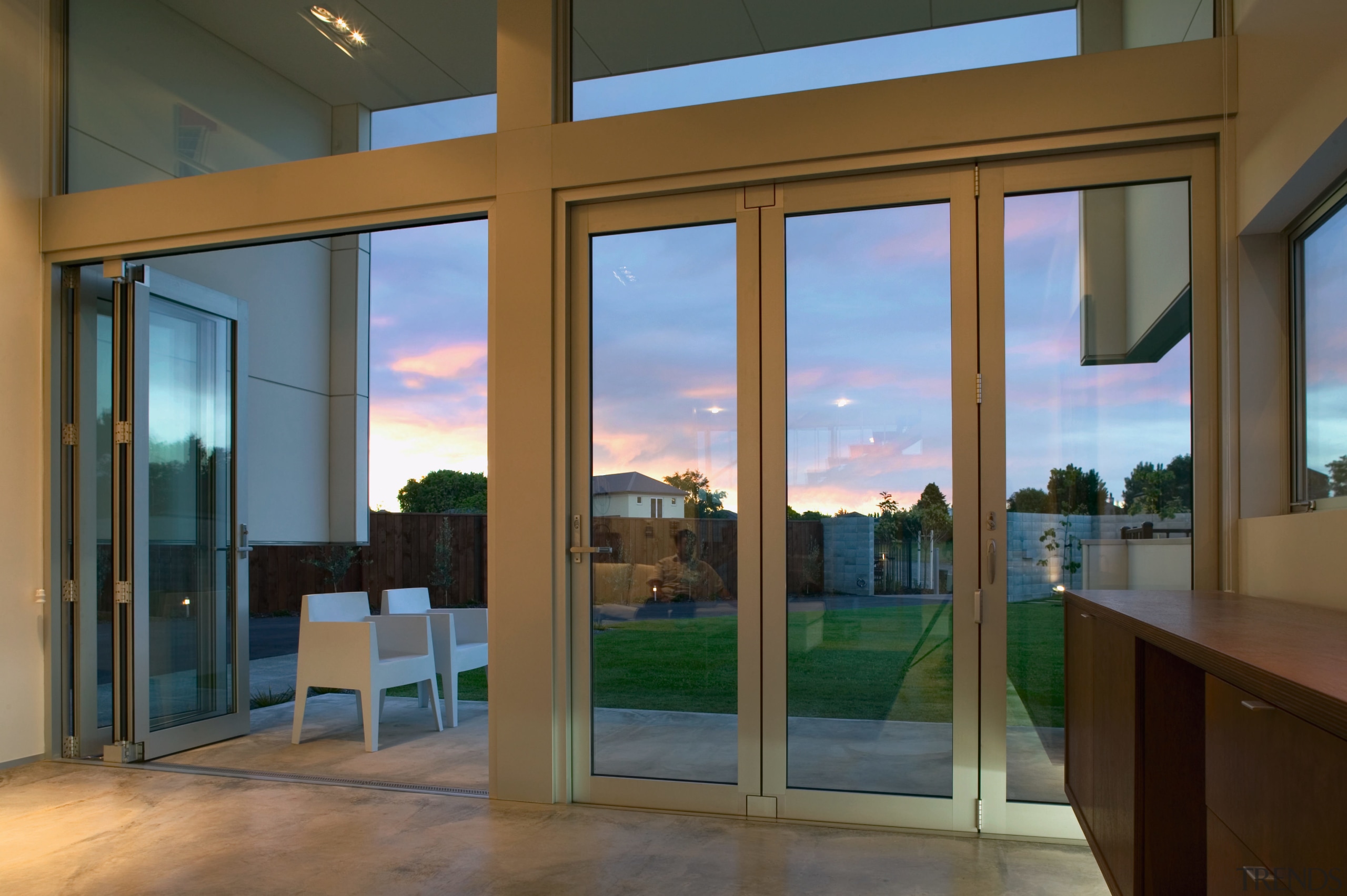 view of these bifold doors that open out door, glass, interior design, real estate, window, brown