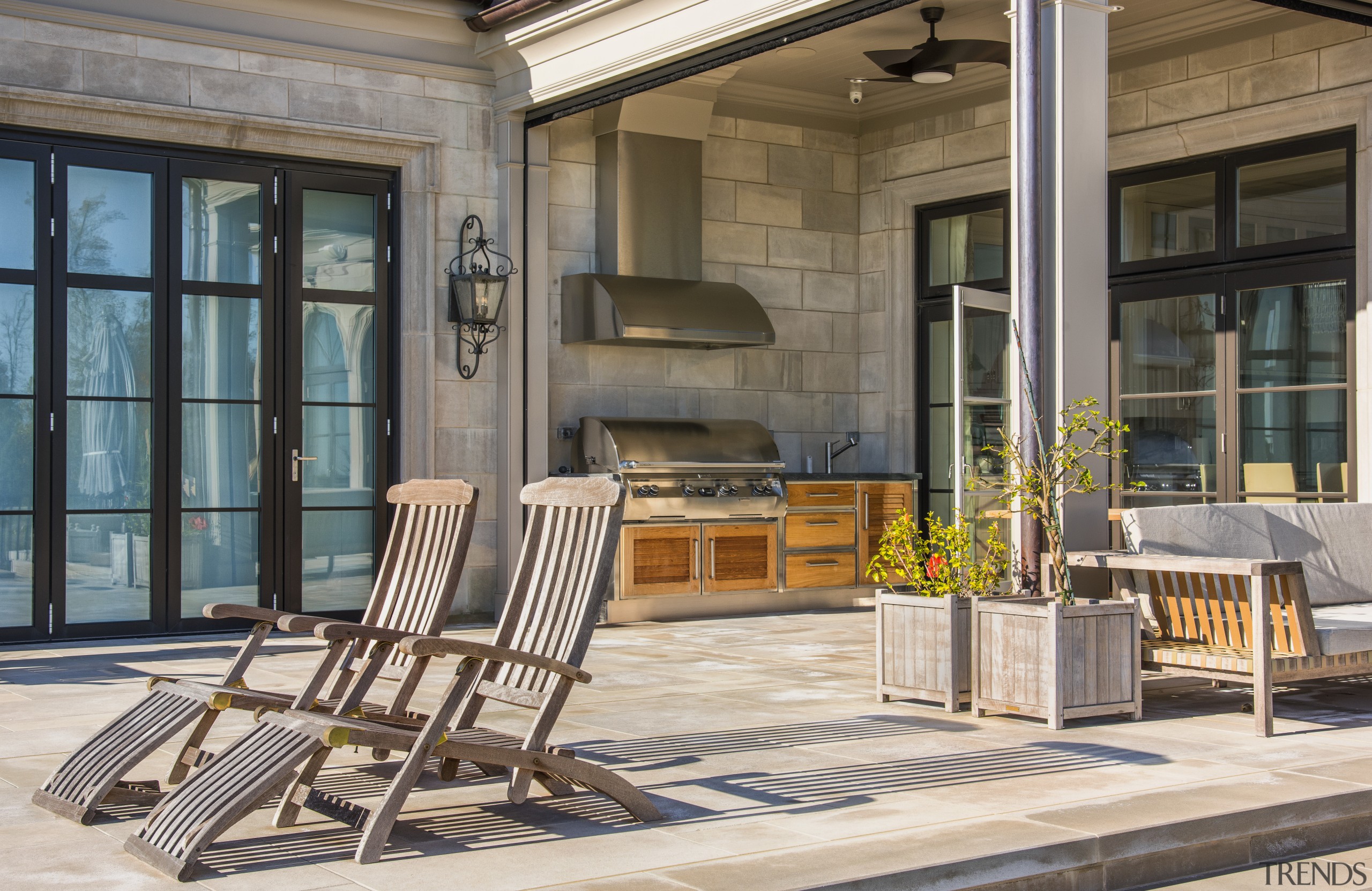 Shirley McFarlane designed this outdoor barbeque area as chair, door, furniture, interior design, outdoor structure, patio, porch, real estate, table, window