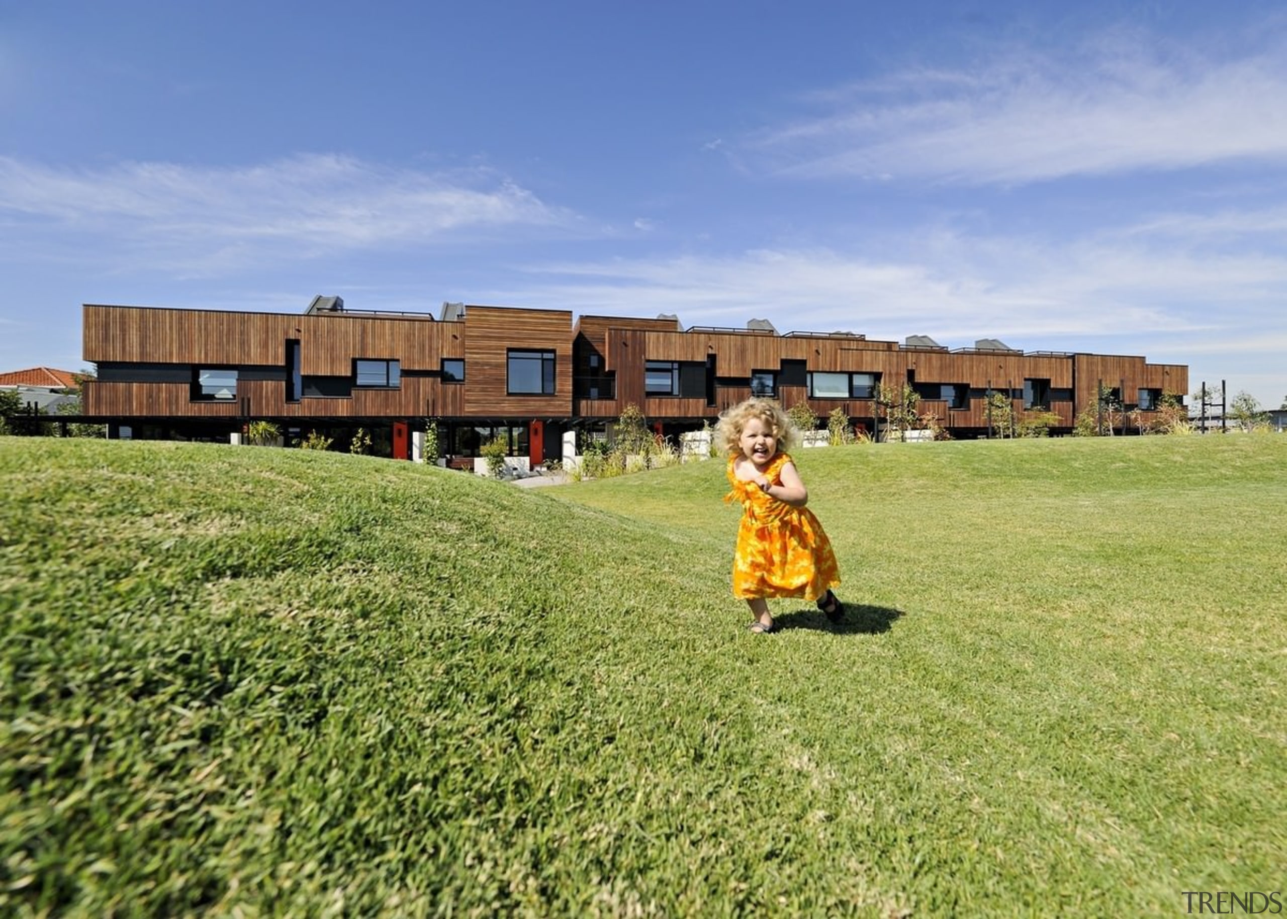 The surrounding lawn makes this development perfect for farm, field, grass, grassland, home, house, land lot, landscape, lawn, meadow, pasture, plant, prairie, property, recreation, residential area, rural area, sky, teal, yellow