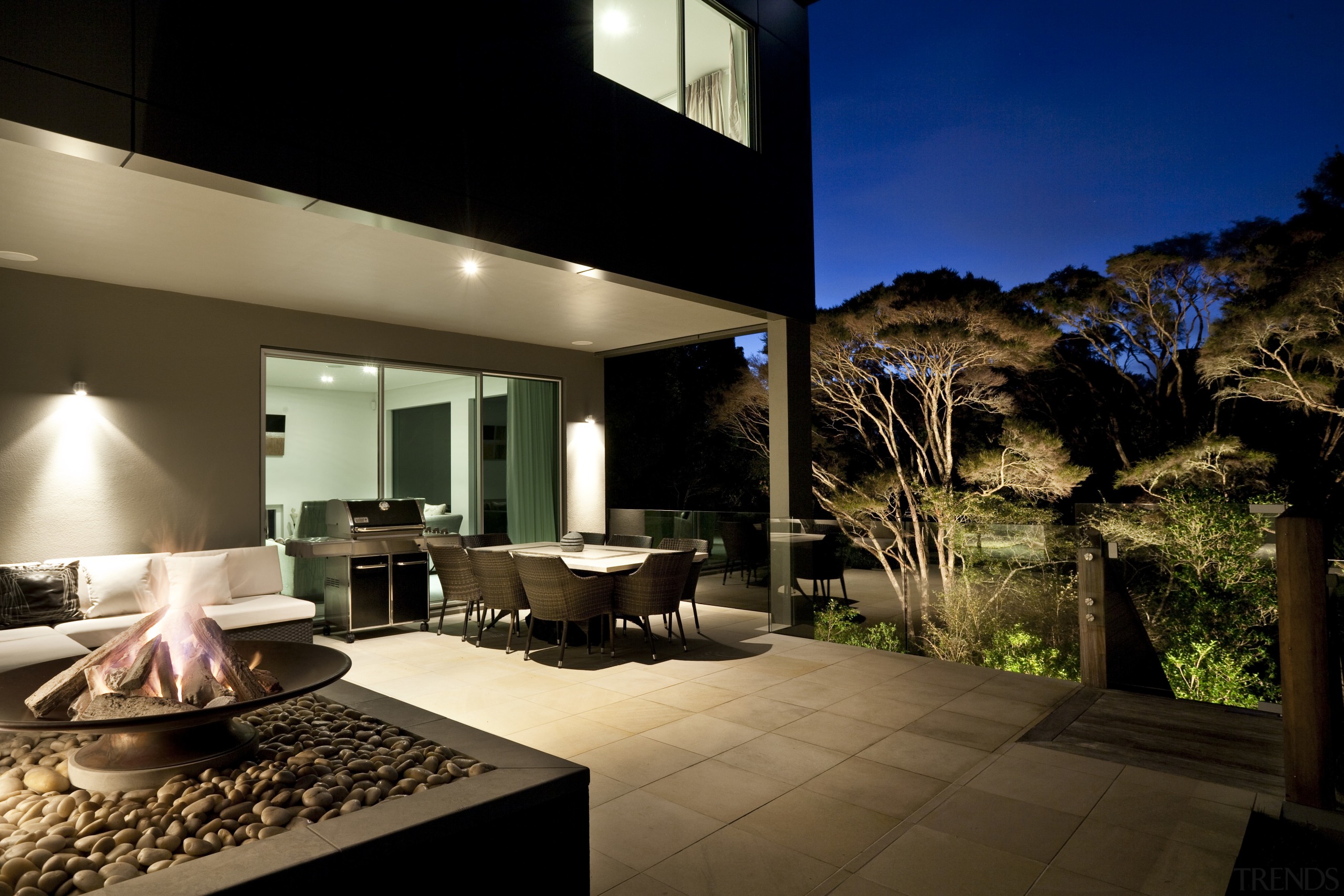 View of sleek poolscape with textured stone wall, architecture, estate, home, house, interior design, lighting, property, real estate, window, brown, black