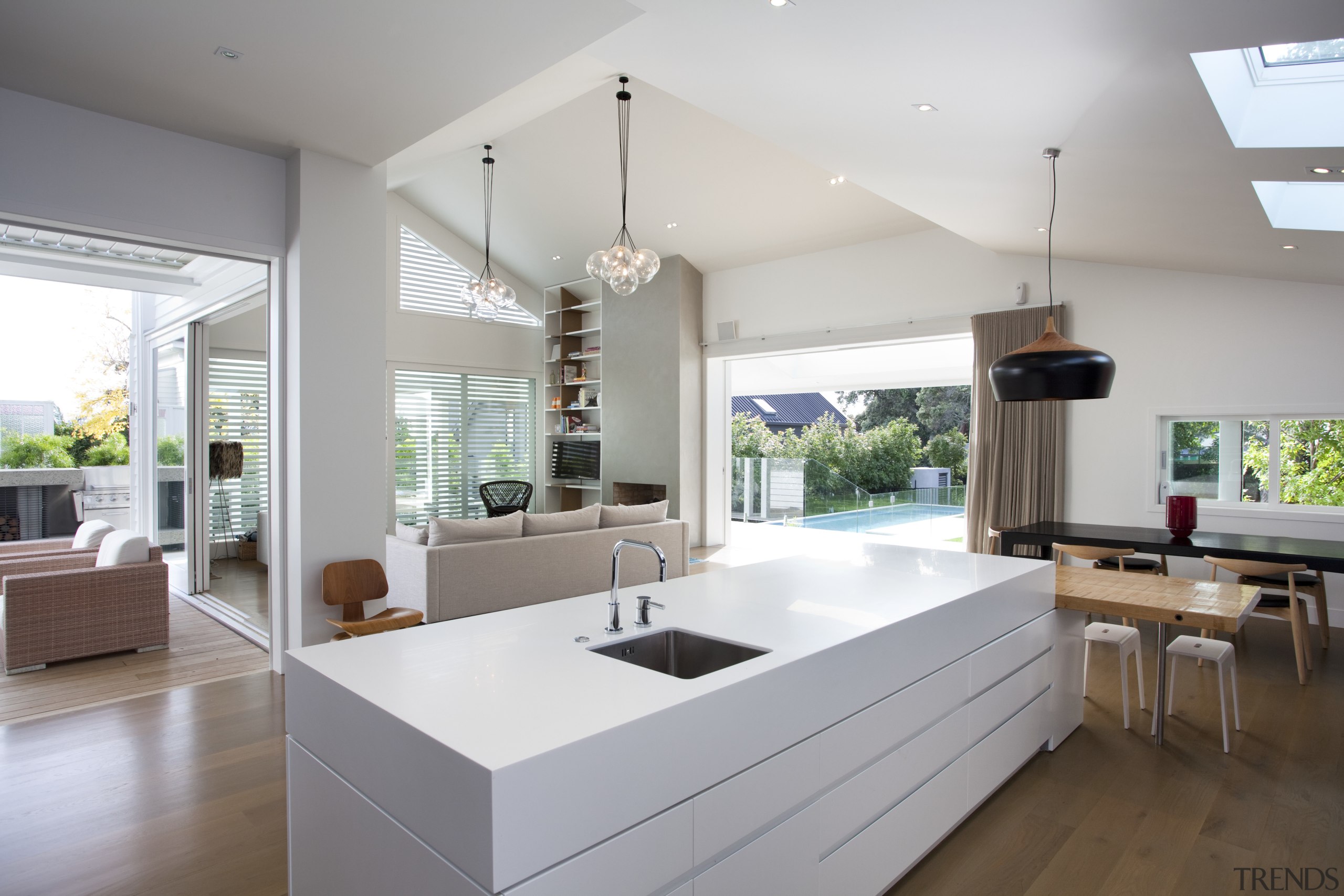 This kitchen and living room in a renovated architecture, countertop, house, interior design, kitchen, living room, real estate, gray, white