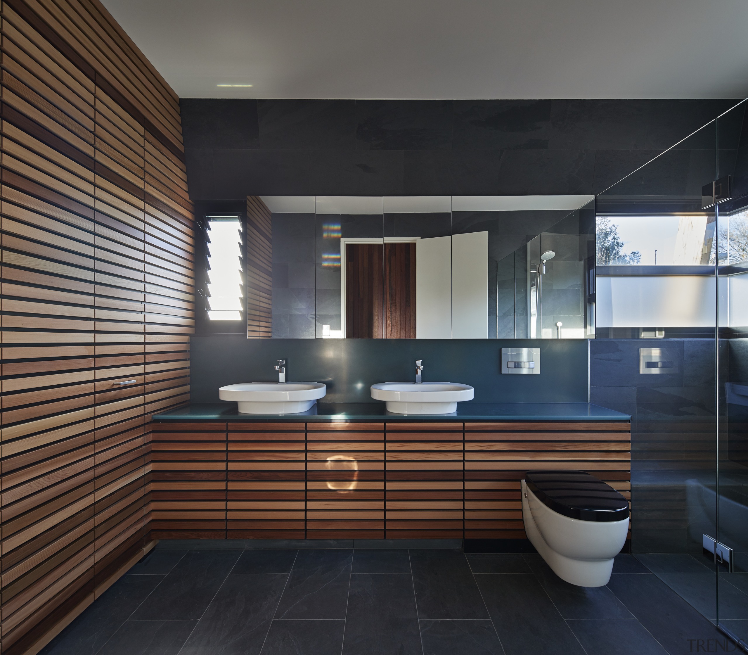 This is one of two identical bathrooms in architecture, bathroom, interior design, room, black, gray