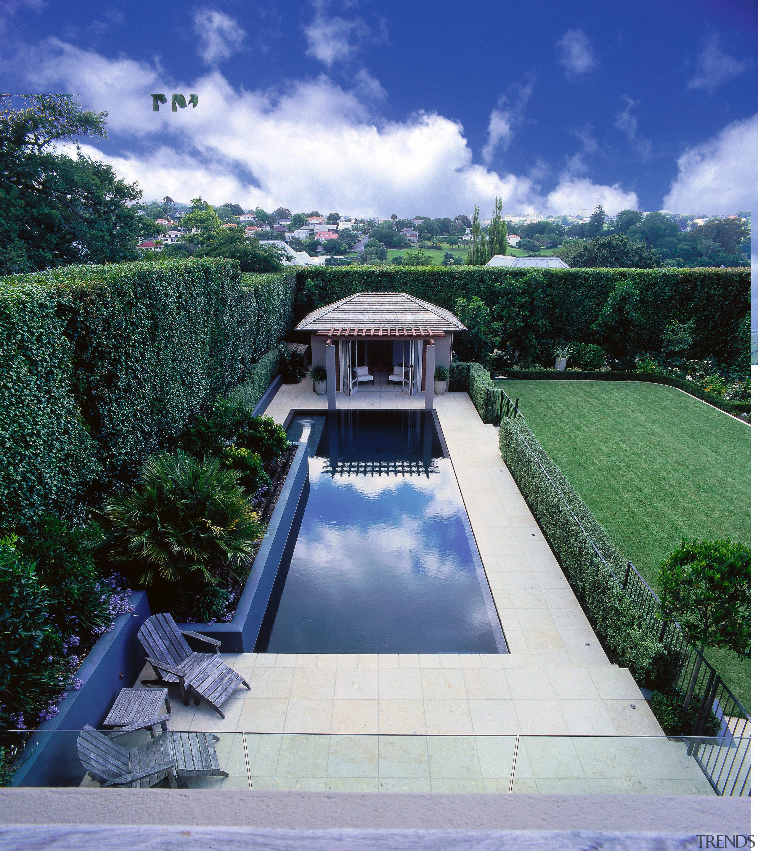 The pool adjoins a large flat lawn. - architecture, cloud, estate, grass, house, landscape, property, real estate, reflecting pool, roof, sky, swimming pool, water, water feature, water resources, blue