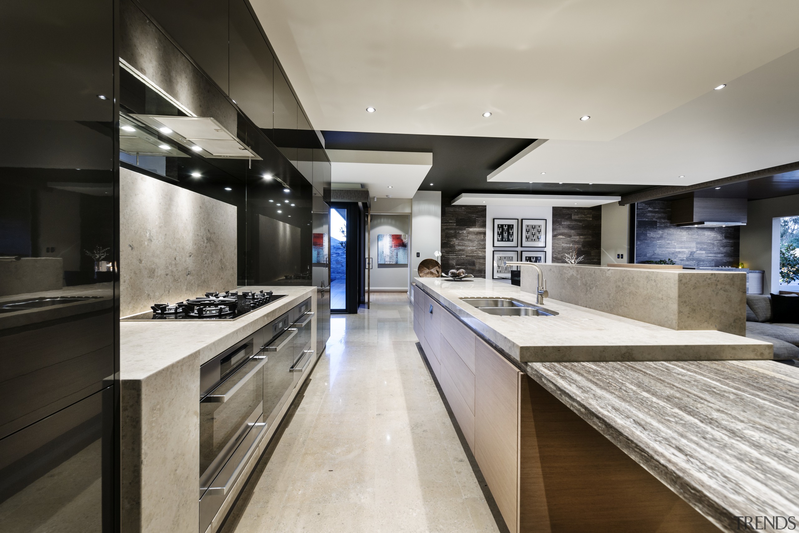 The sandstone benchtop on this island sits atop countertop, interior design, kitchen, gray, black