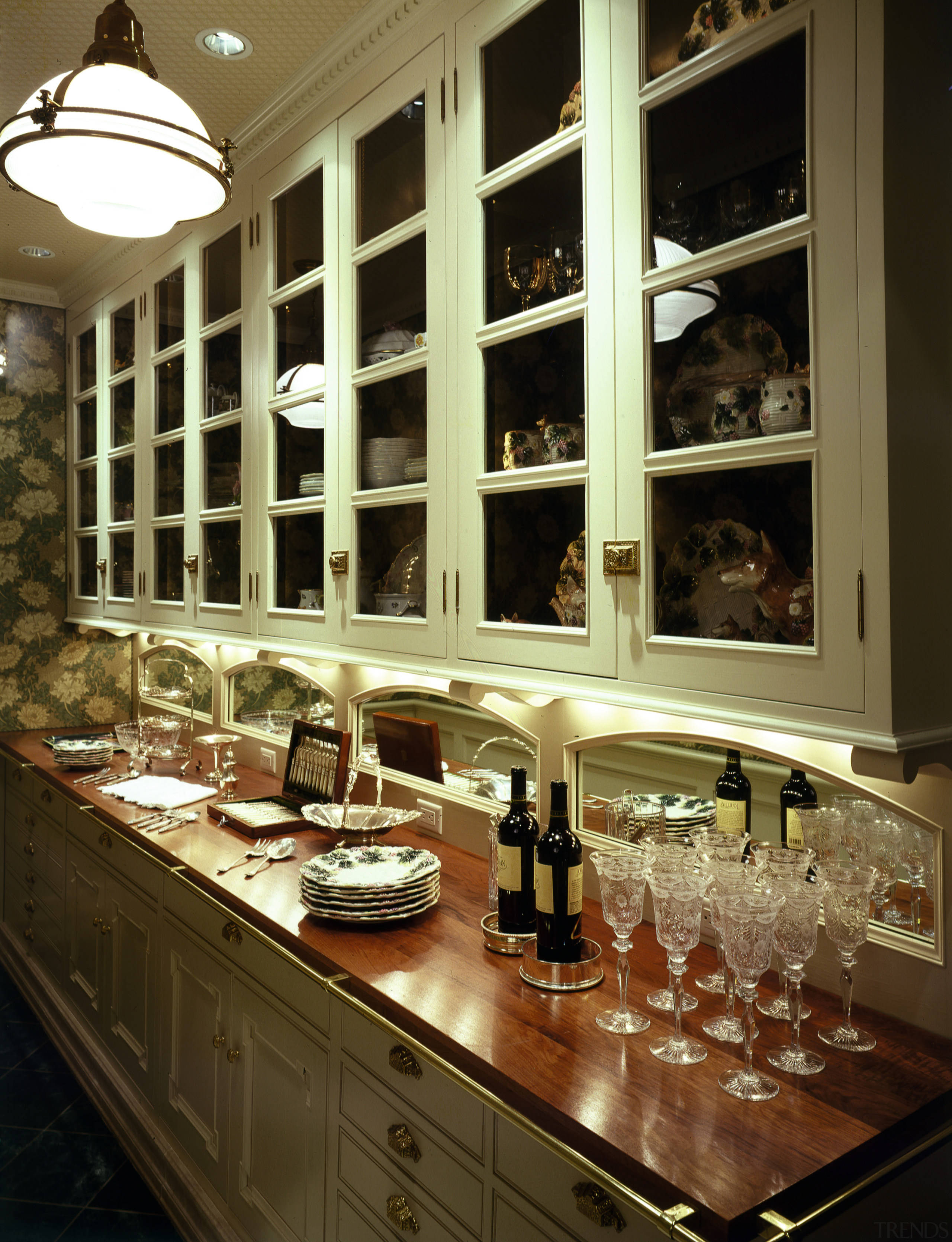 A view of the kitchen featuring tiled flooring, countertop, glass, interior design, kitchen, window, brown